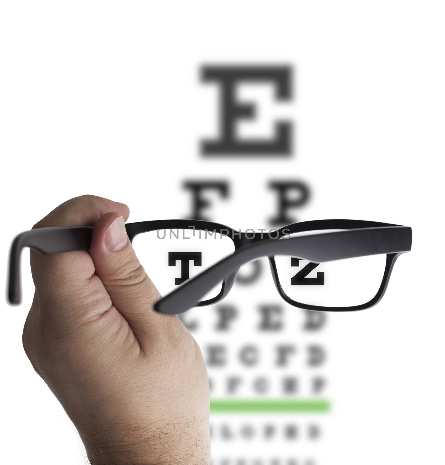 Eye glasses on eyesight test chart background