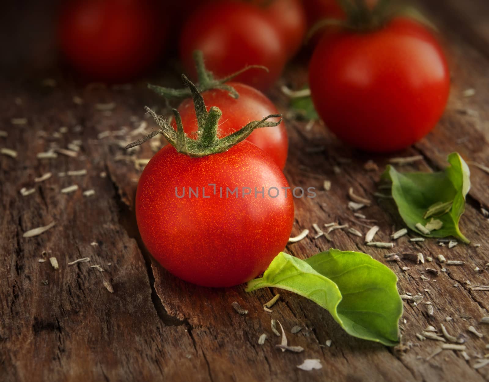 Tomatoes cherry on a wooden surface with natural light