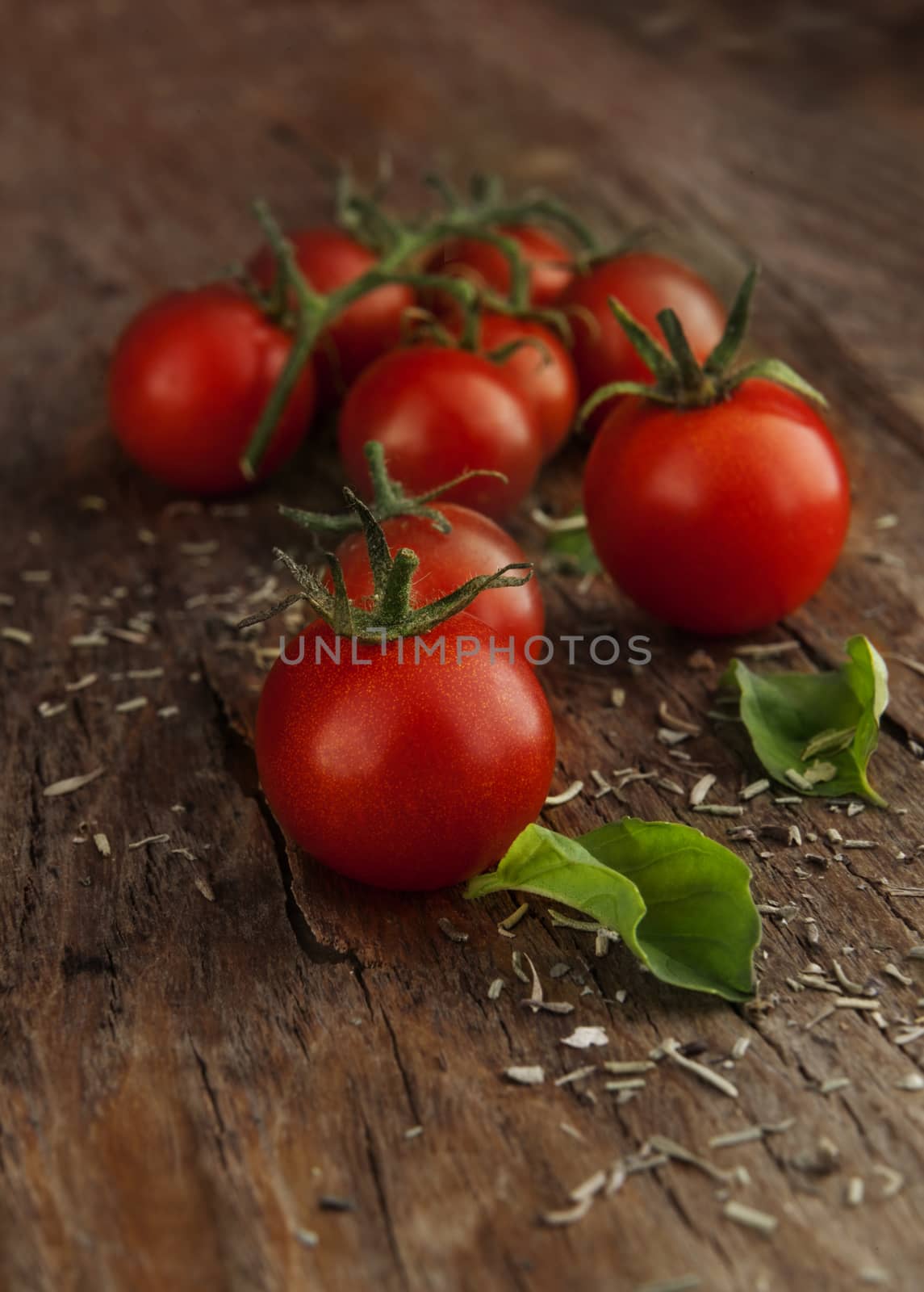 Cherry tomatoes on a wooden surface with natural light
