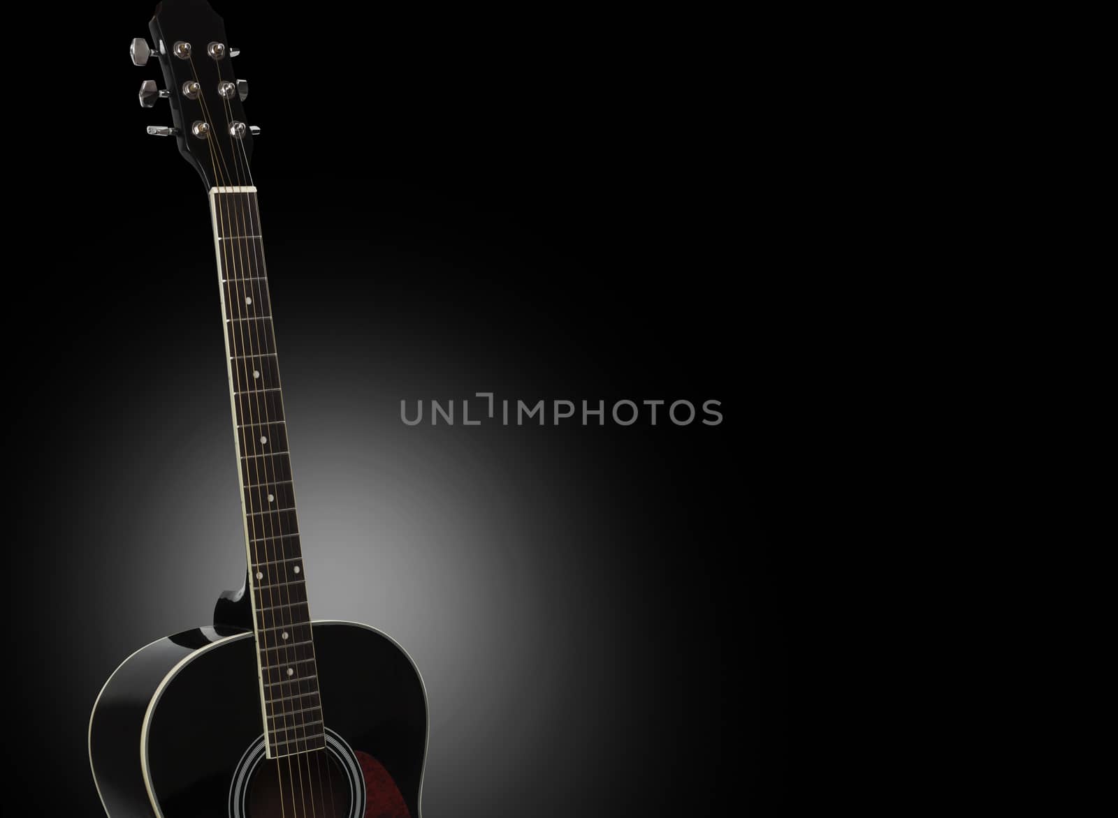 Acoustic guitar isolated on a black background. With clipping path