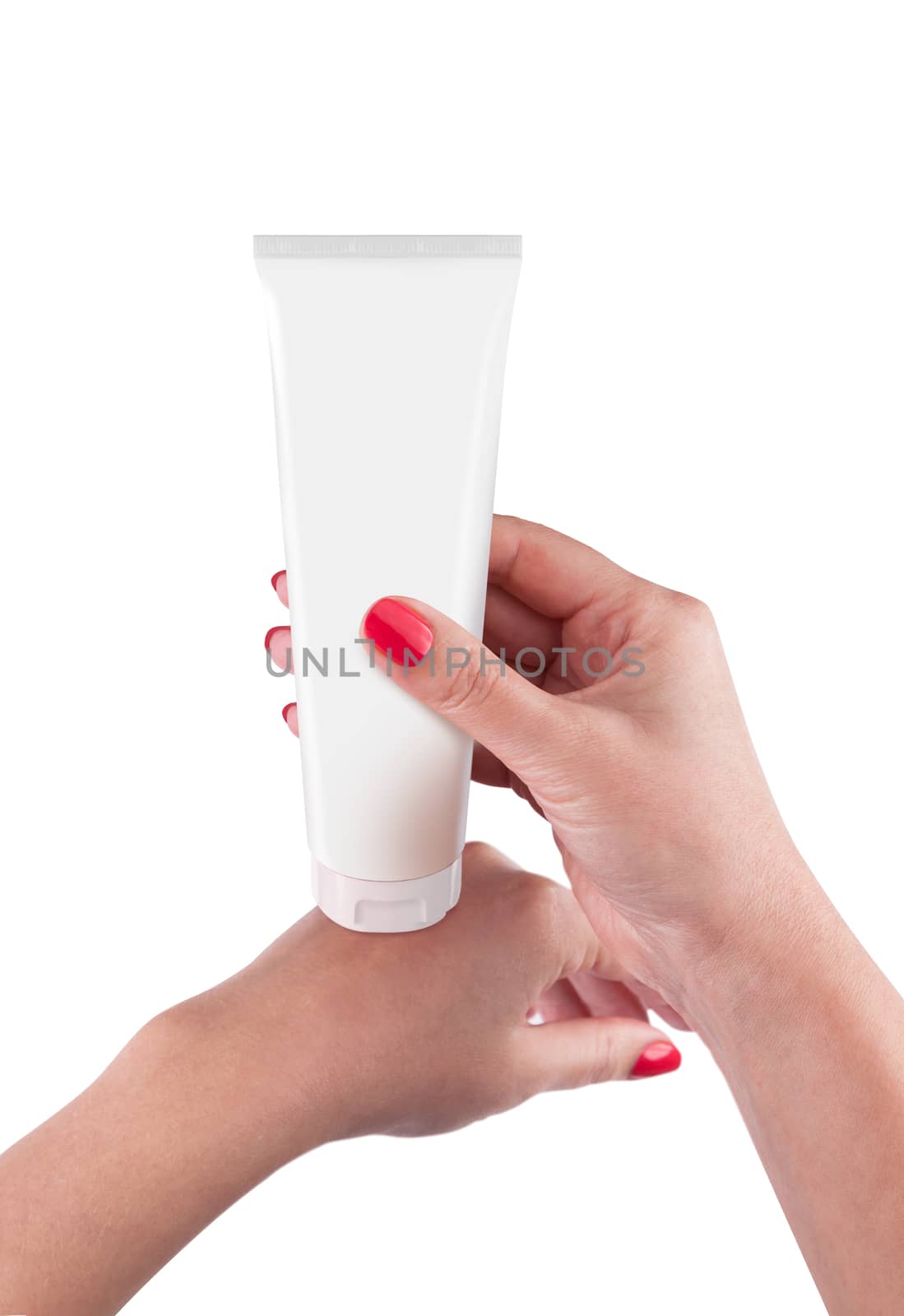 Hand holding cream tube isolated on white background. With clipping path