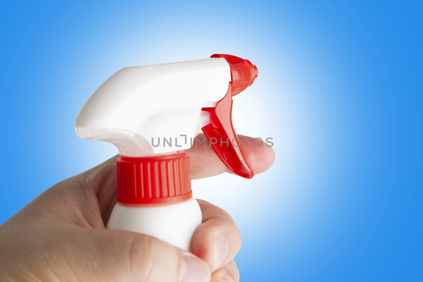 Hand holding white plastic spray bottle. With clipping path.