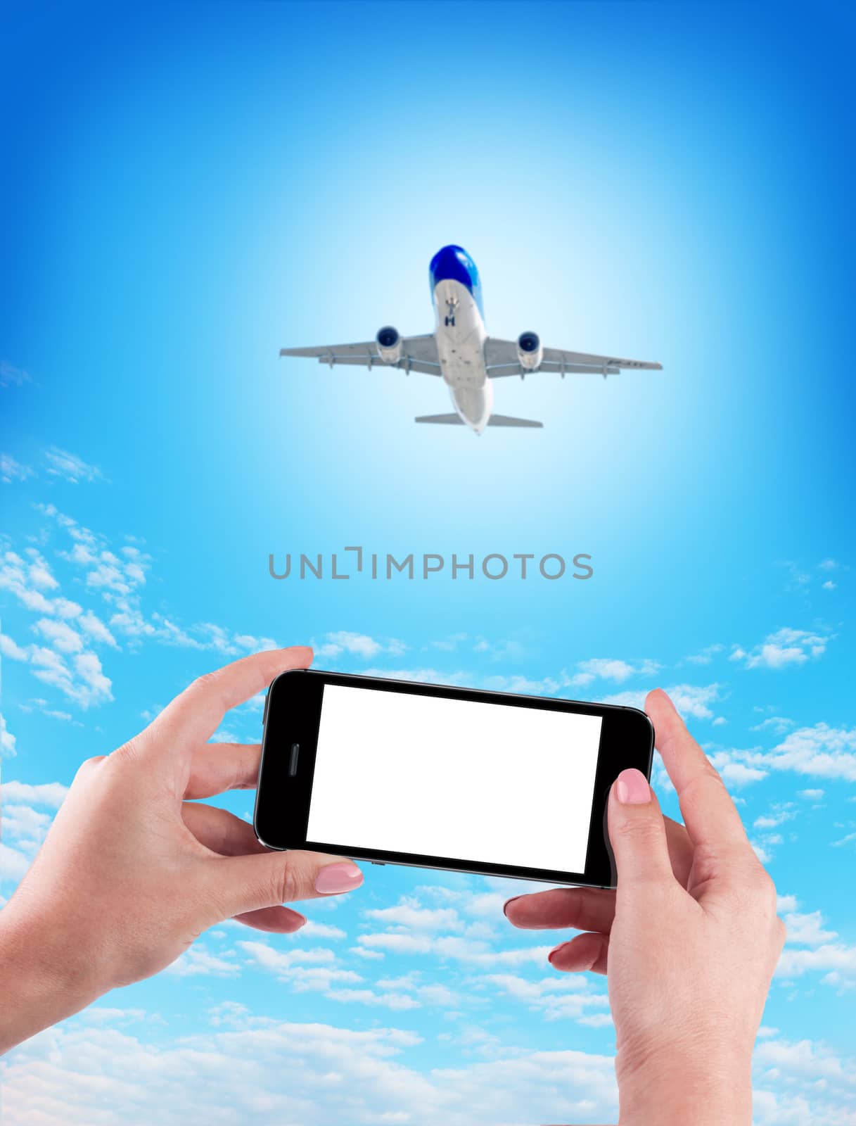 Female Hand holding using mobile phone and airplane on a blue background