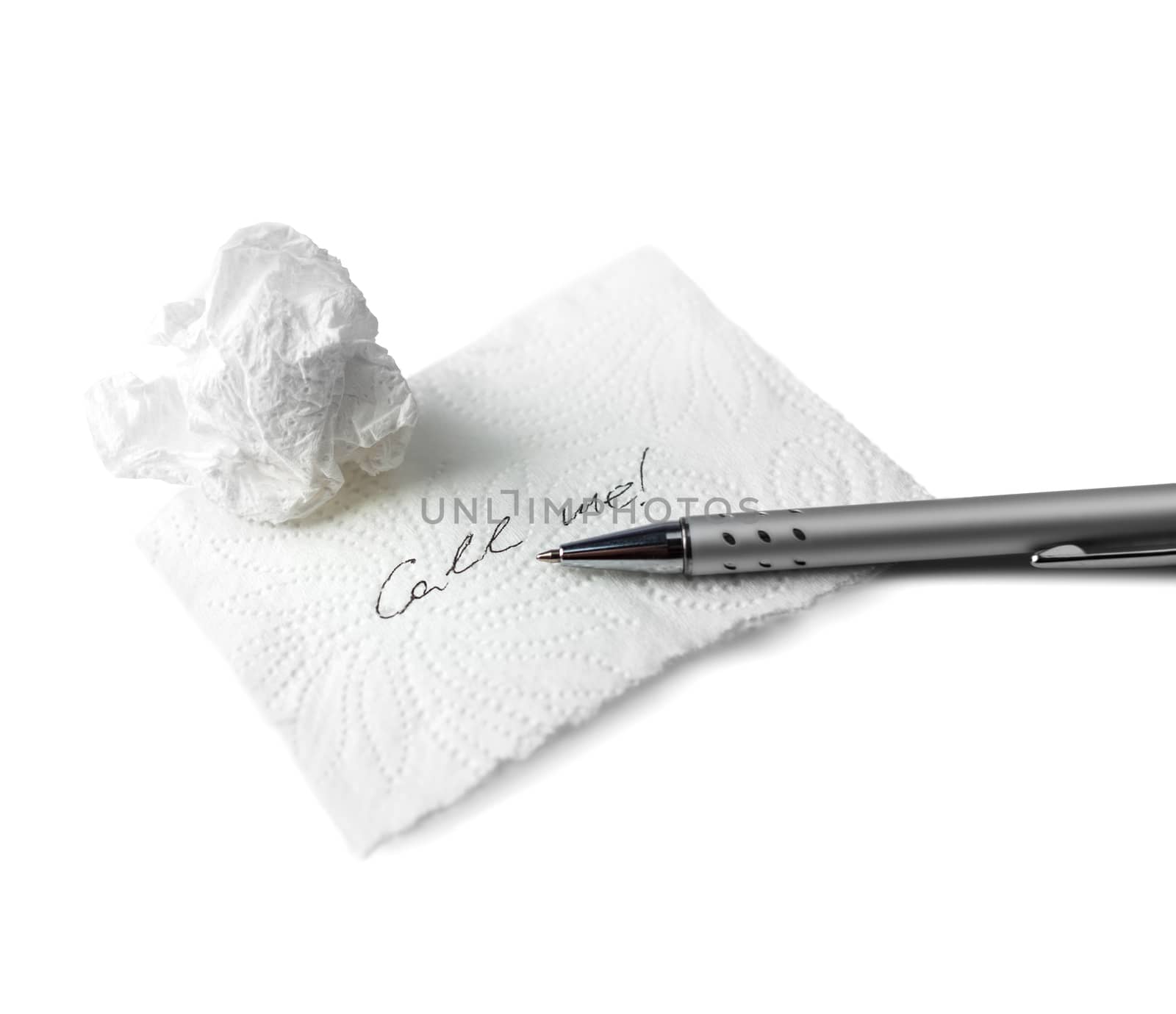 Napkin With Scribbled text, paper ball and Pen on Table on white background