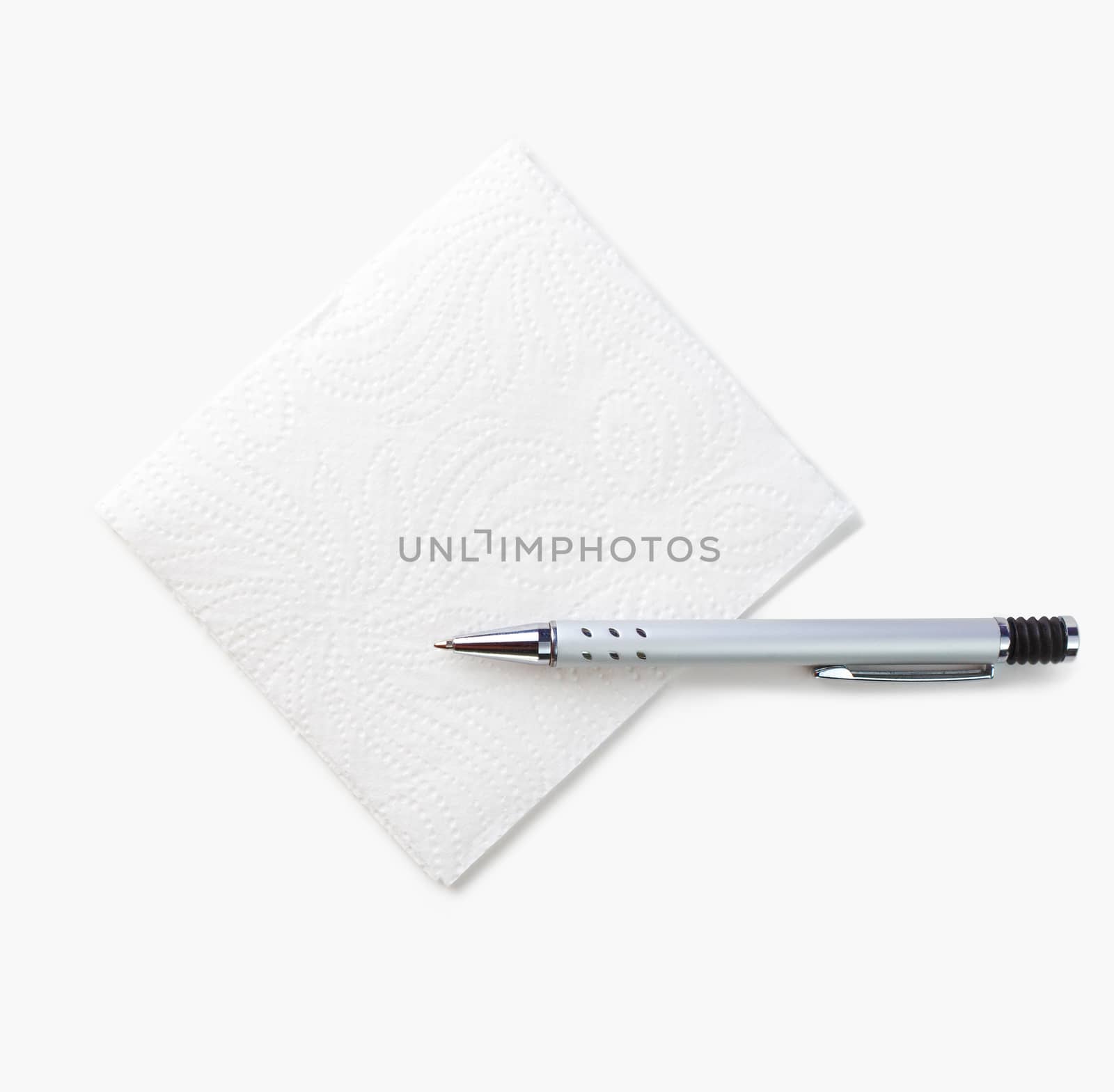 White napkin and pen for notes isolated on a white background. The view from the top.