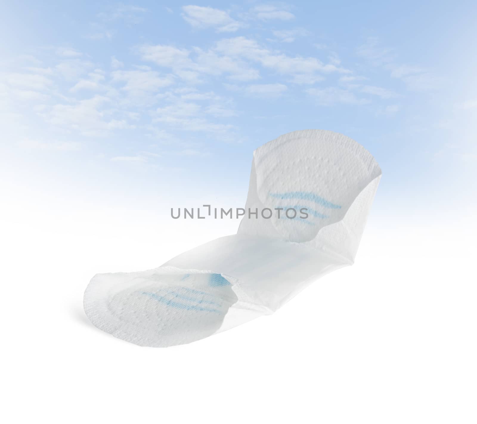 Female hygiene pad on a blue sky background. With clipping path.