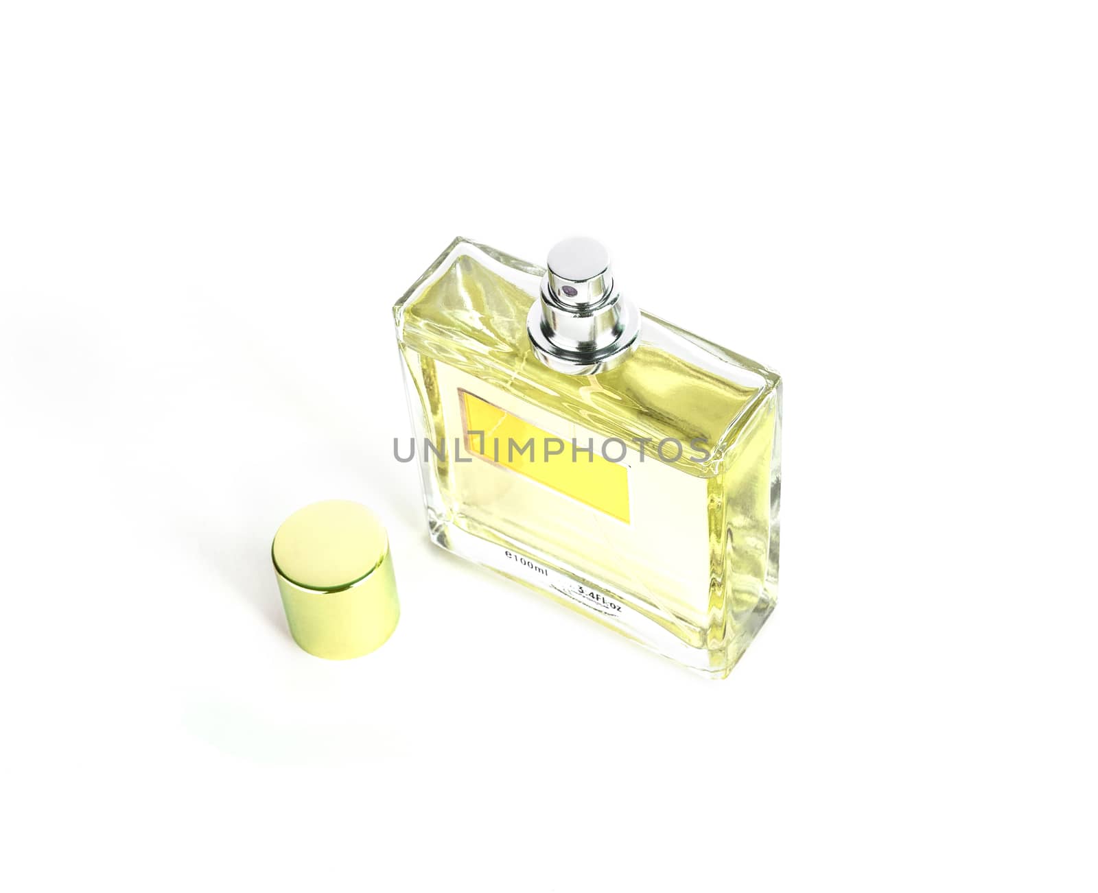 Perfume in beautiful yelow color bottle isolated on white background