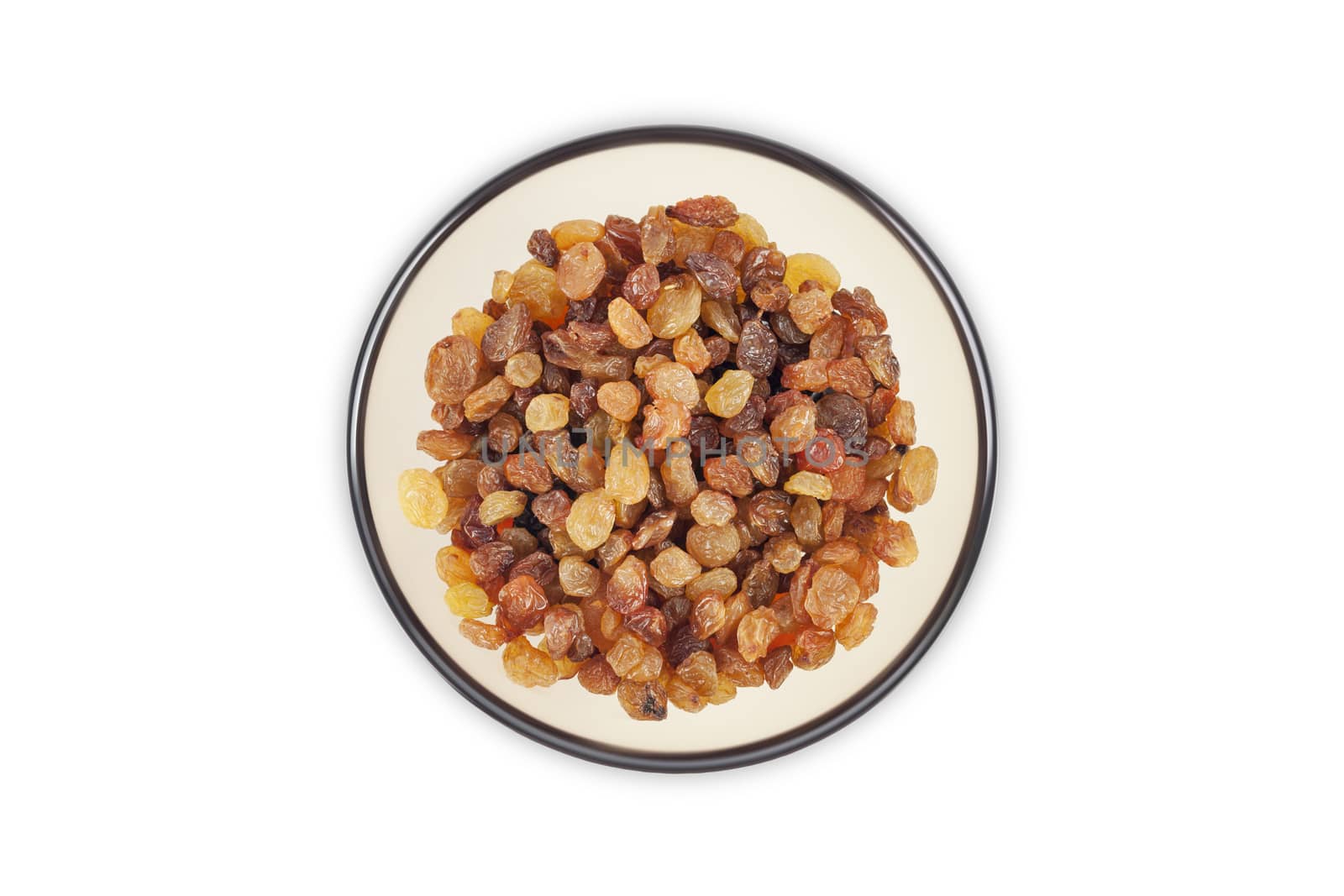 Raisins in a clear glass dish top view close up isolated