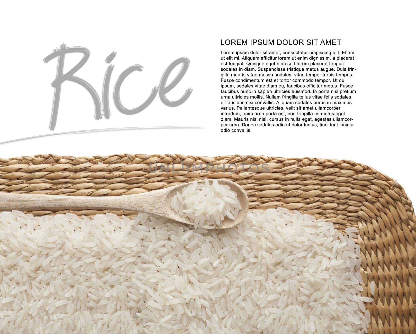 Asian uncooked white rice in a wooden spoon on a background of straw.