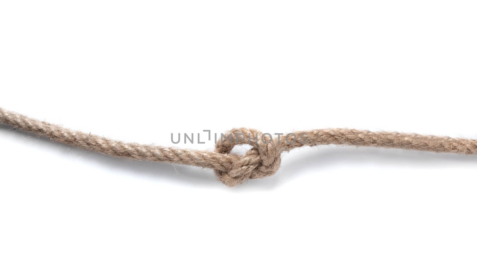 Rope with knot isolated over white background. Bluren concept