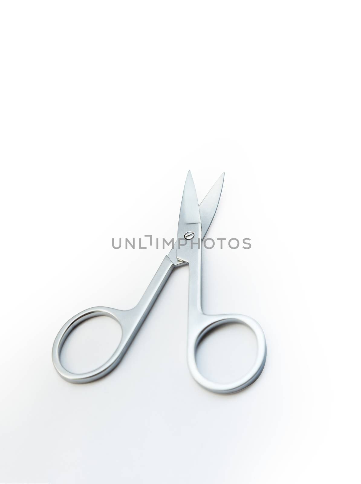 Small steel nail scissors on white background