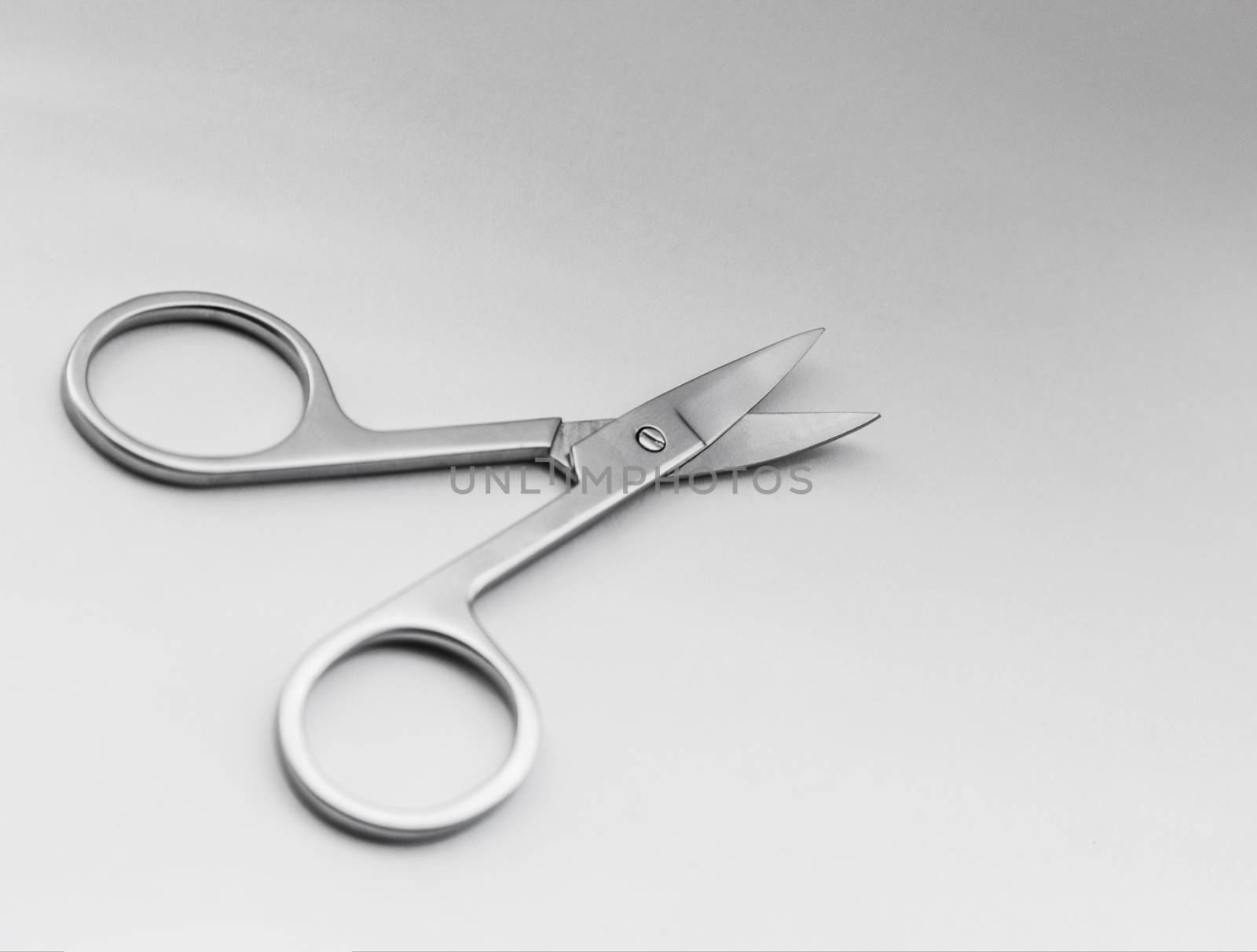 Small steel nail scissors on white background