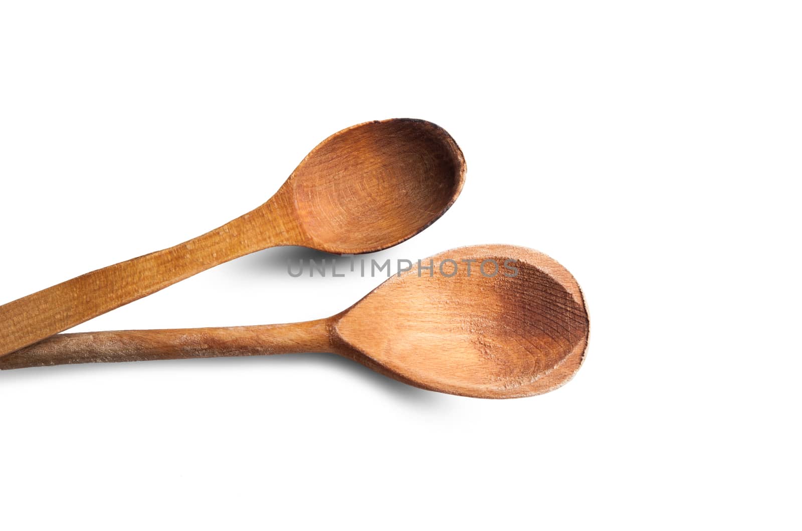 Two wooden spoons isolated on white background