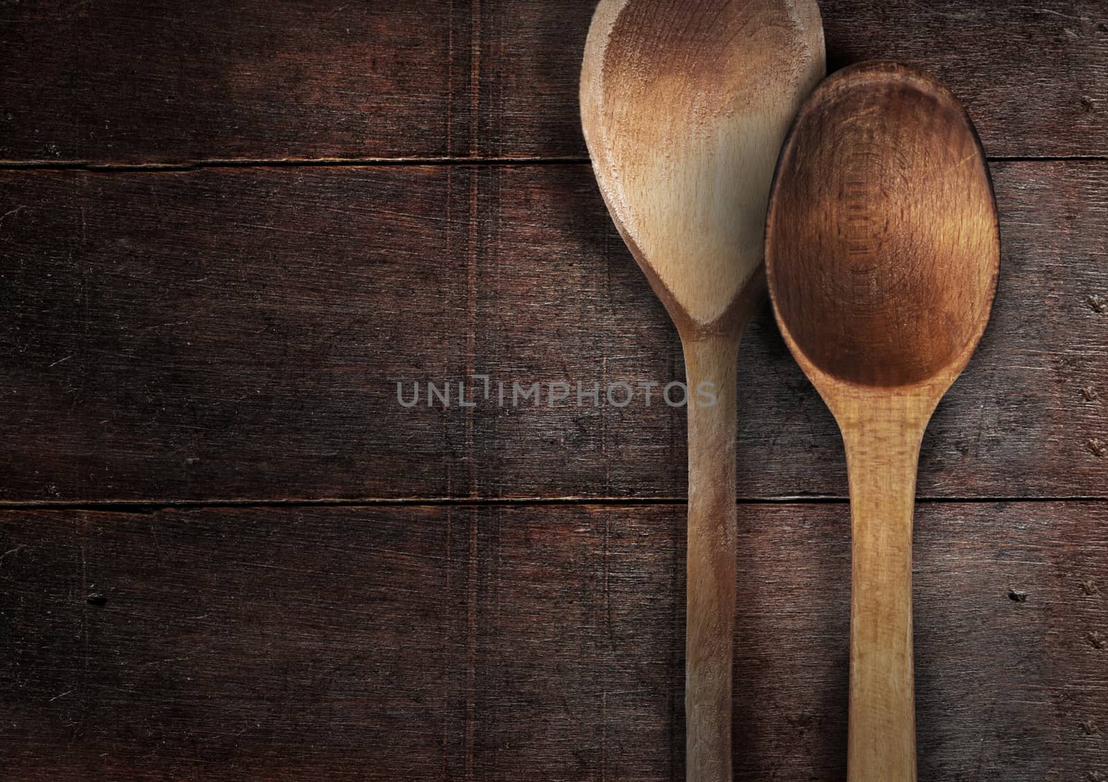 old wooden spoons on the wood table
