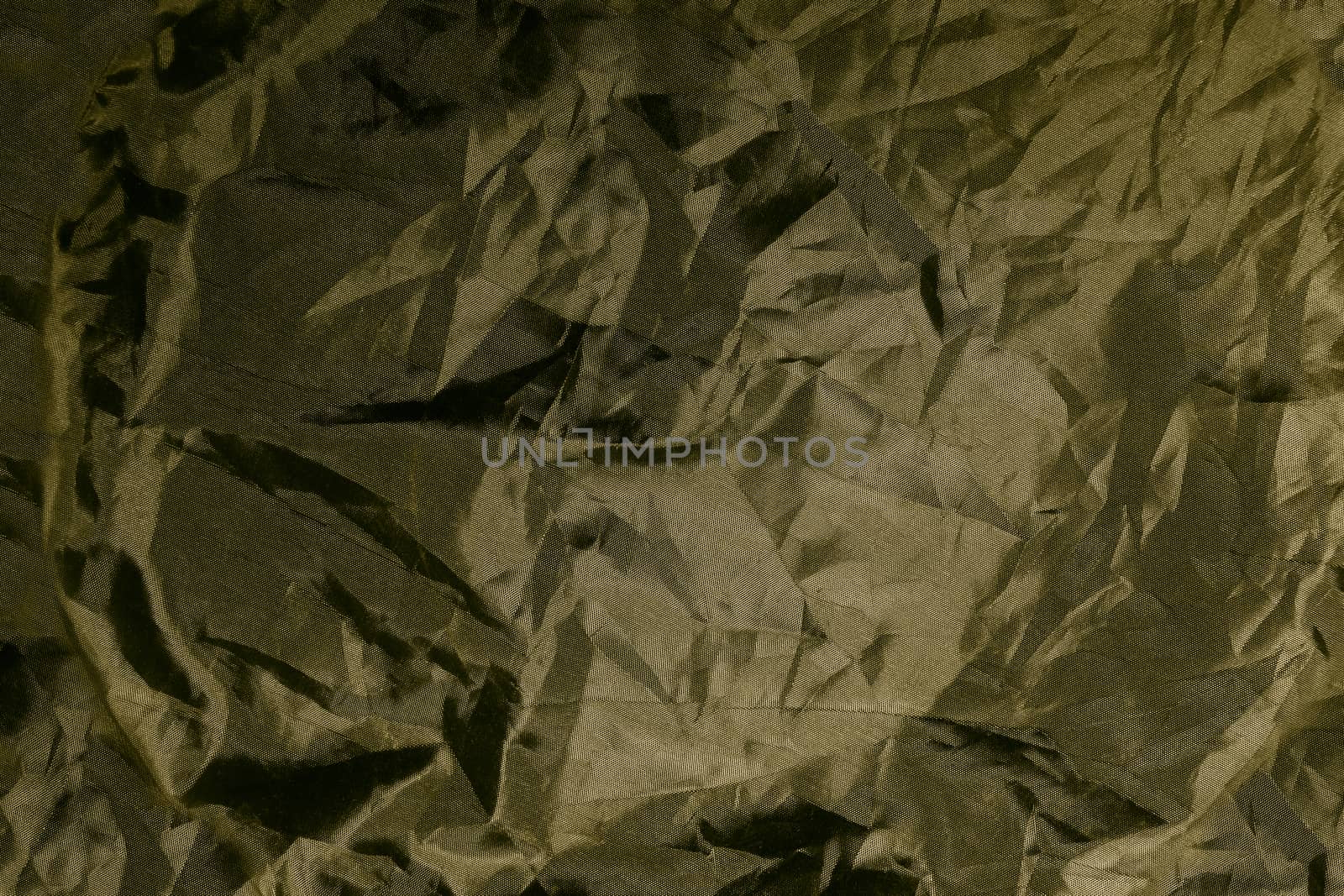 Golden rough fabric grunge texture background.