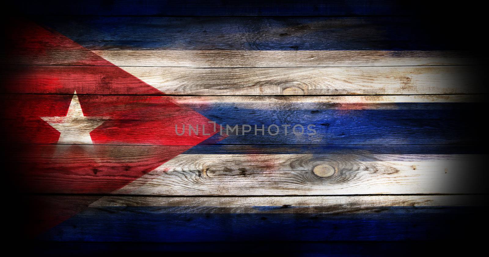 Grunge Cuba flag on a wooden background