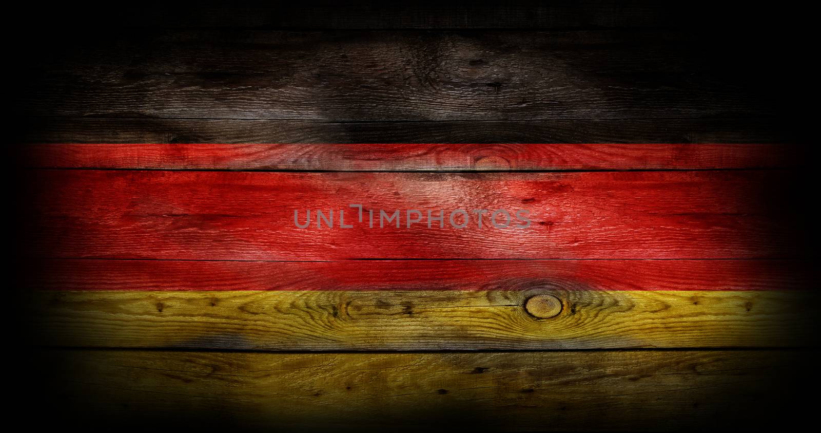 Flag of Germany painted on grungy wood plank