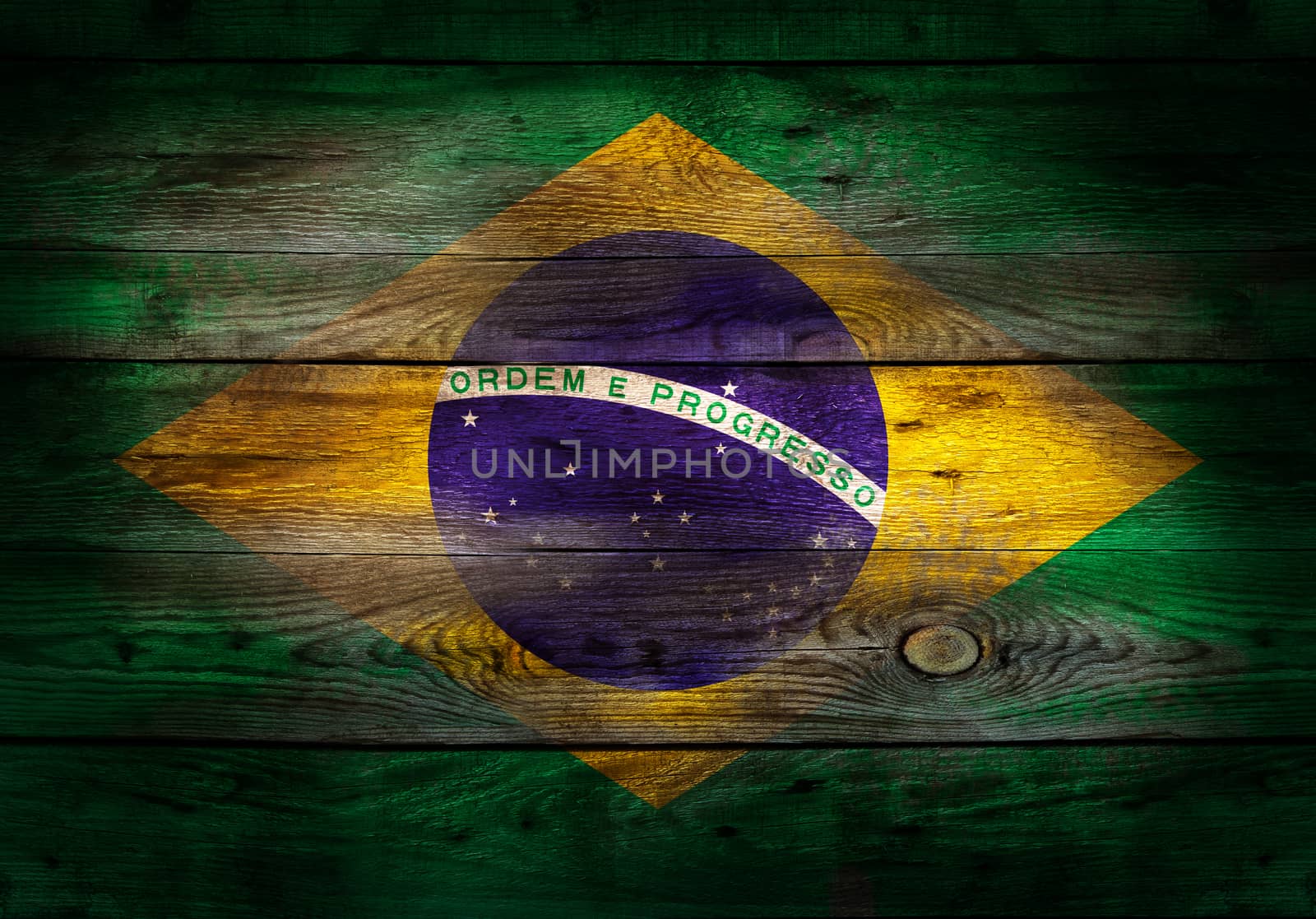 Flag of Brazil painted on grungy wooden plank background