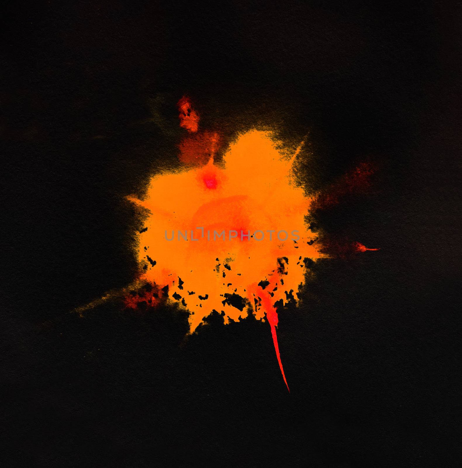 Watercolor orange color splash on black background