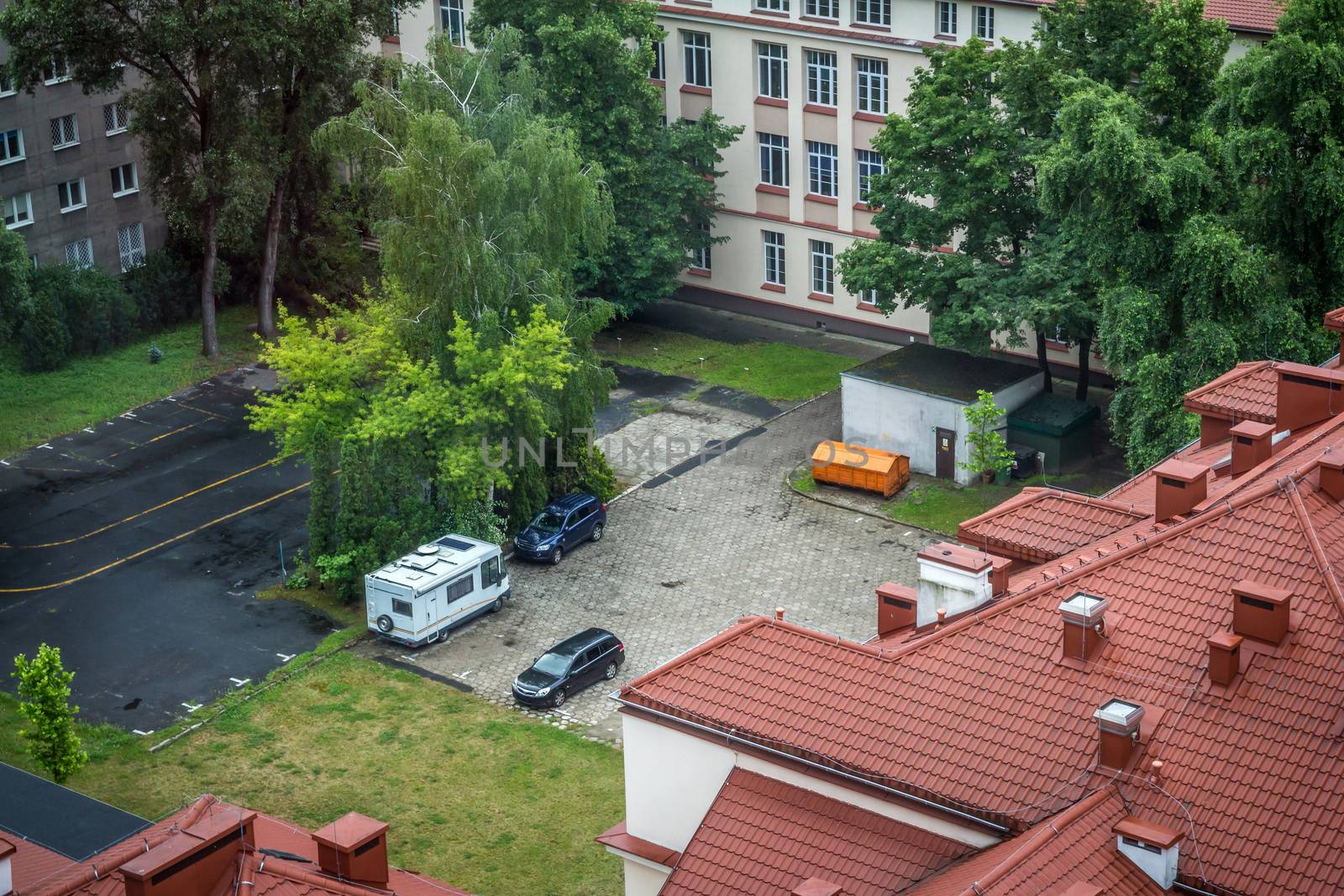 Aerial view of cars and recreational vehicle parking in an urban area at Warsaw in Poland.