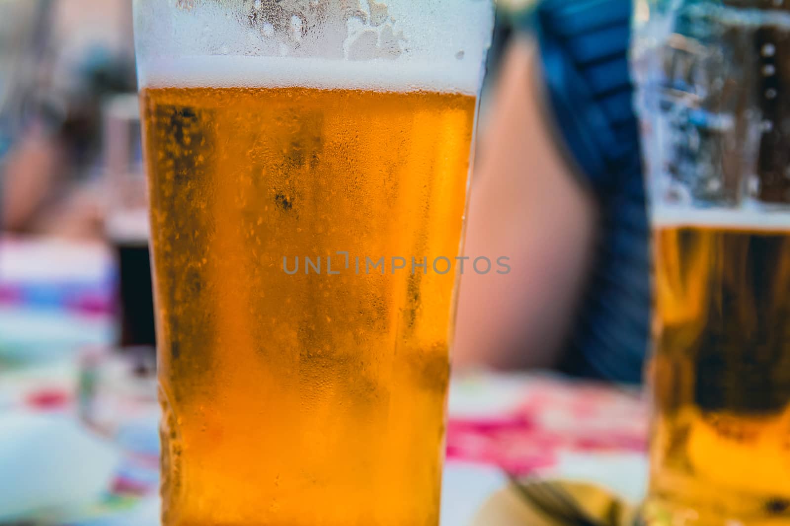 Closeup on a beer glasses at a restaurant.