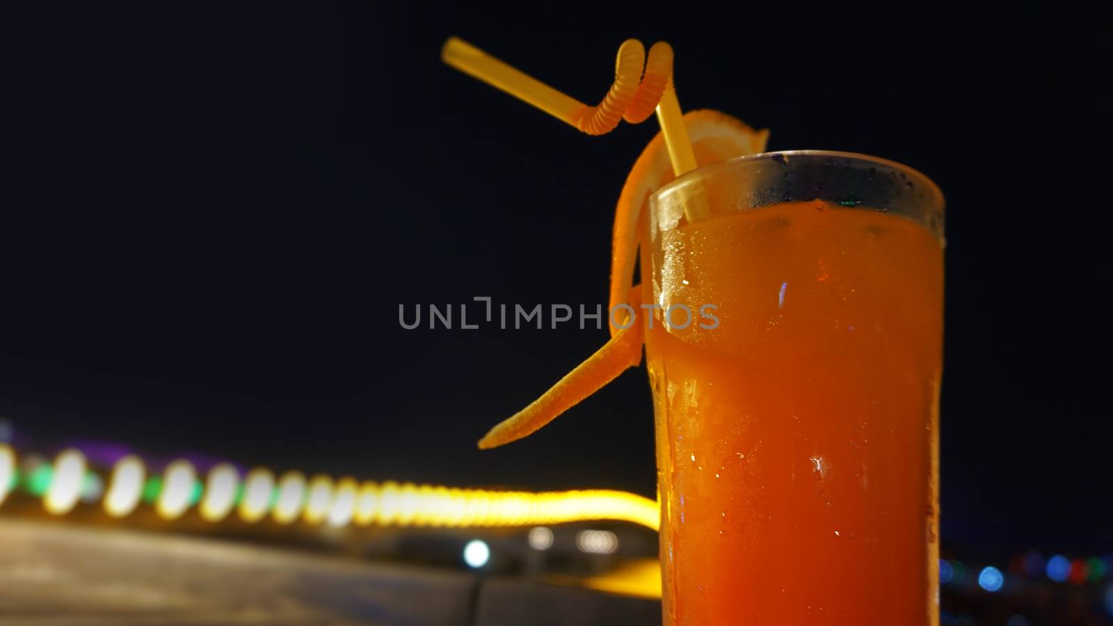 Exotic summer drinks, against blur night city view background