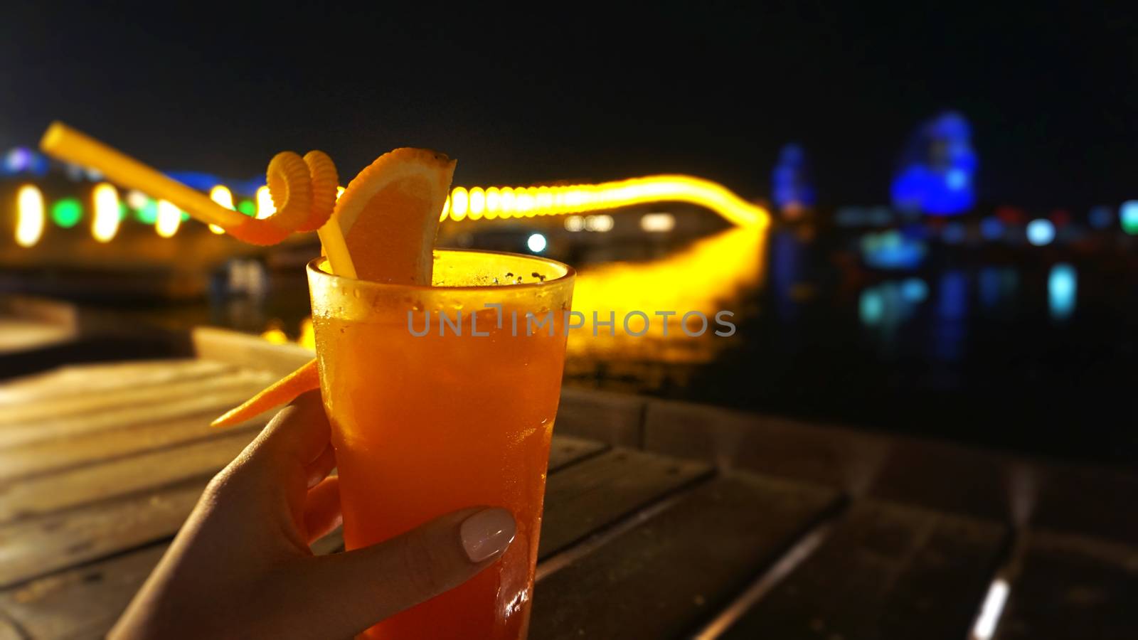 Exotic summer drinks, against blur night city view background