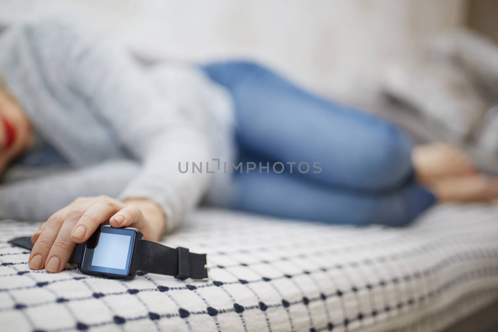Woman sleeping with smart watch 
