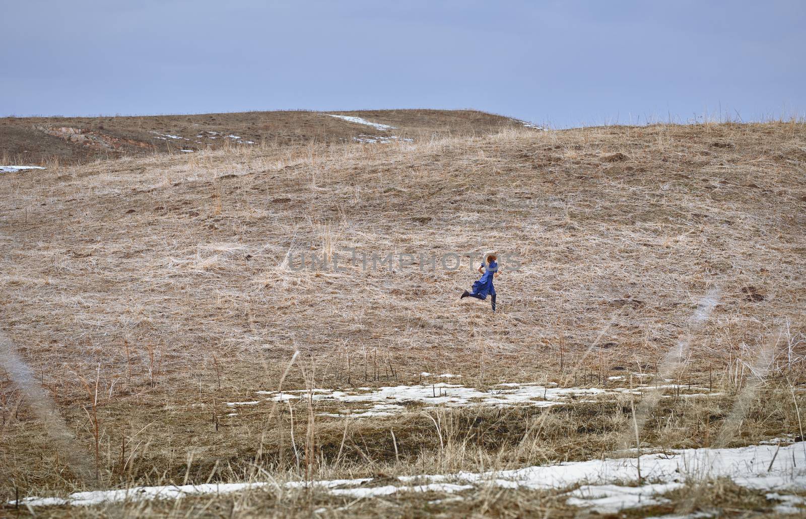 Woman running in the field by Novic