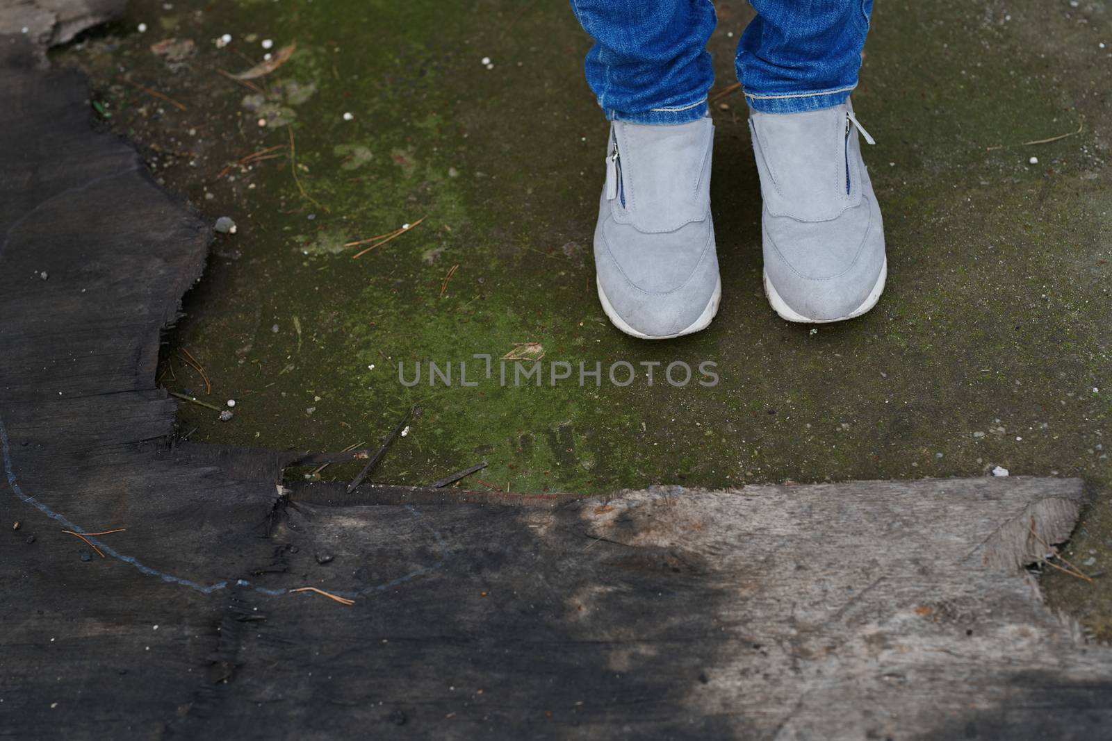 Woman standing on the moss at the old wood trunk by Novic