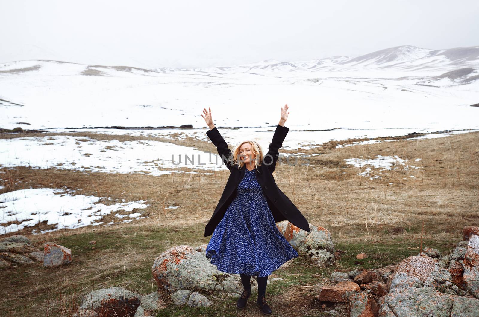 Happy woman in the winter landscape