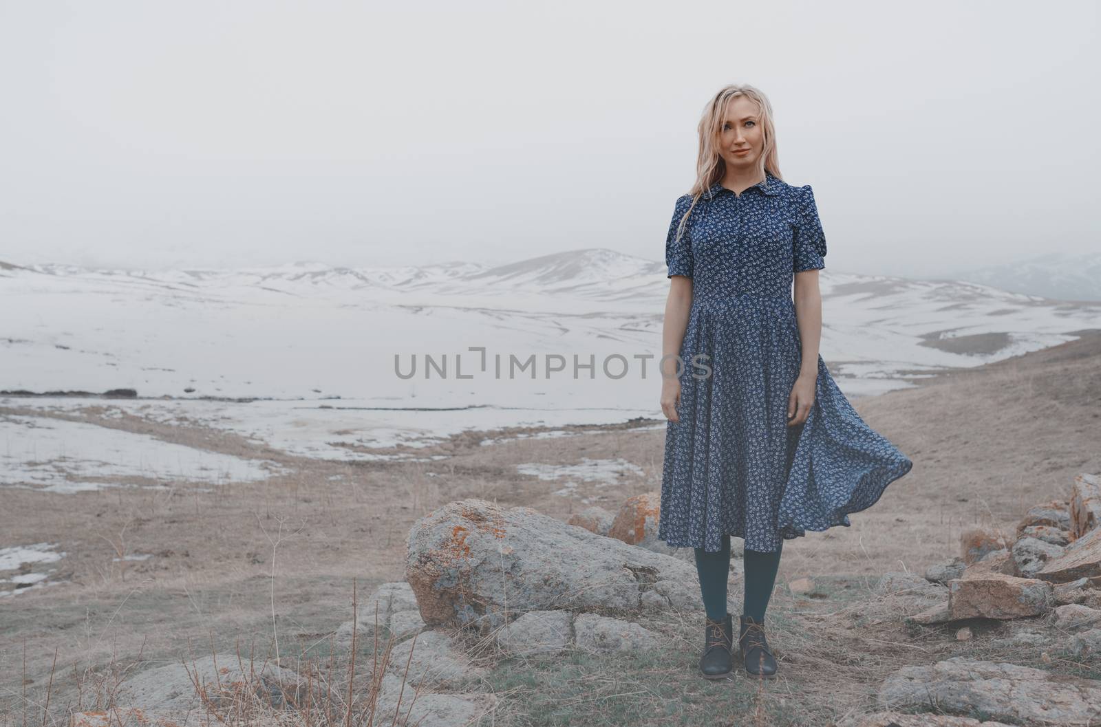 Happy woman having fun in the winter landscape