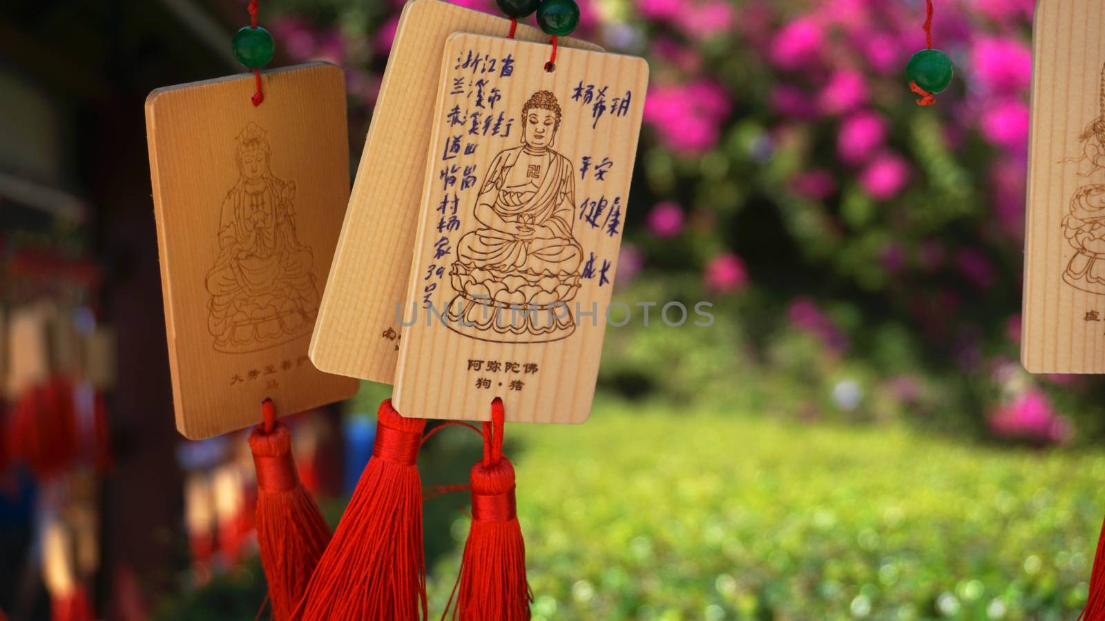 People write and hang Ema Wood tag or Wooden label for praying for good luck by natali_brill