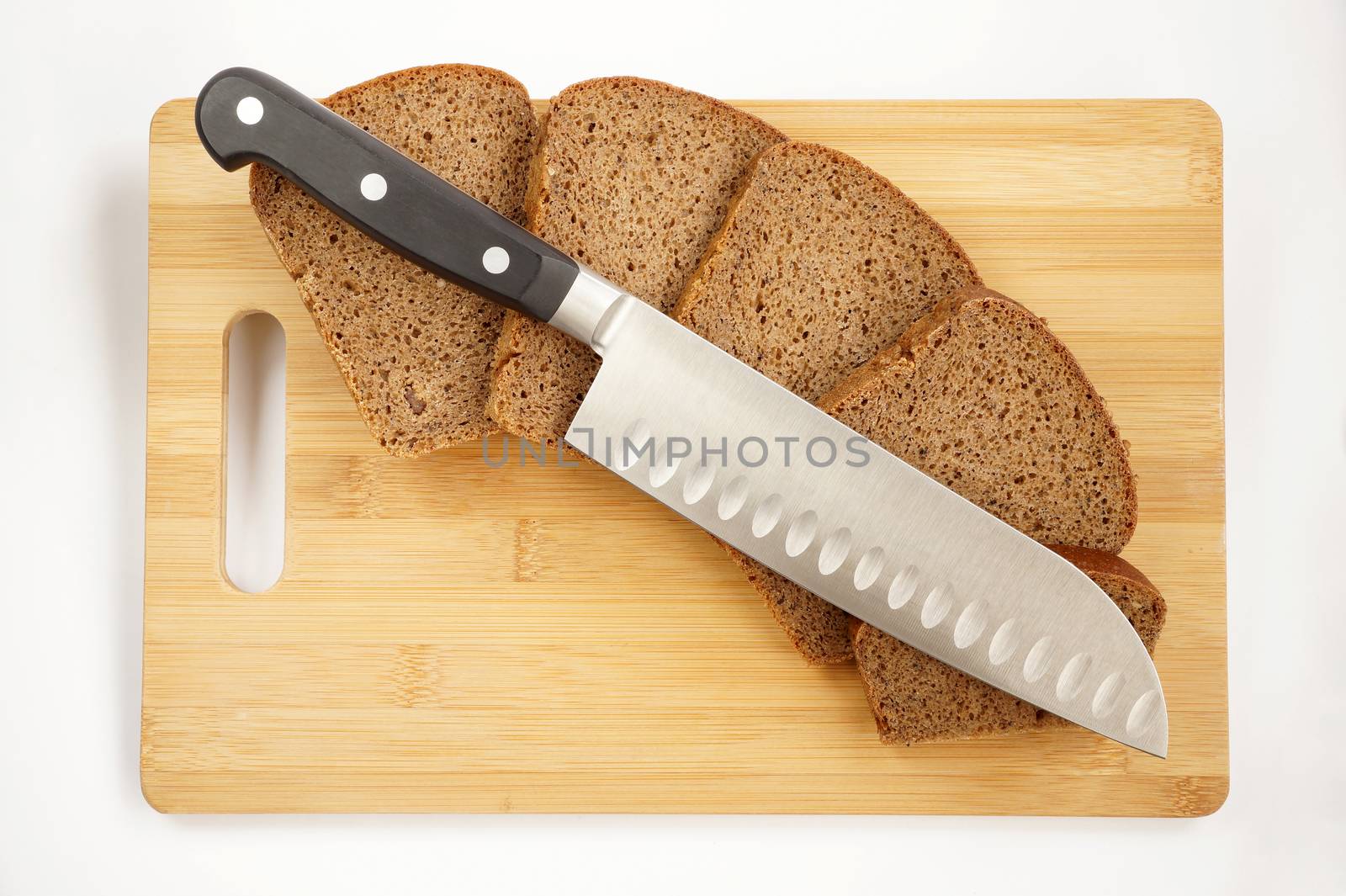 Knife cook universal with a blade like Santoku on a chopping board