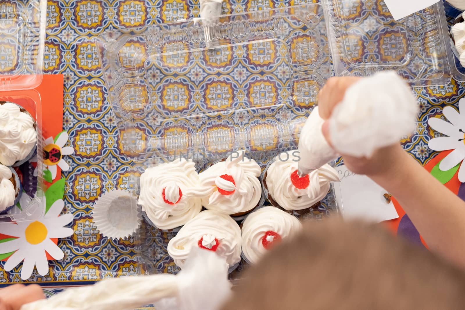 Khabarovsk, Russia - March 02, 2019: cooking master class on making cupcakes with cream. by rdv27