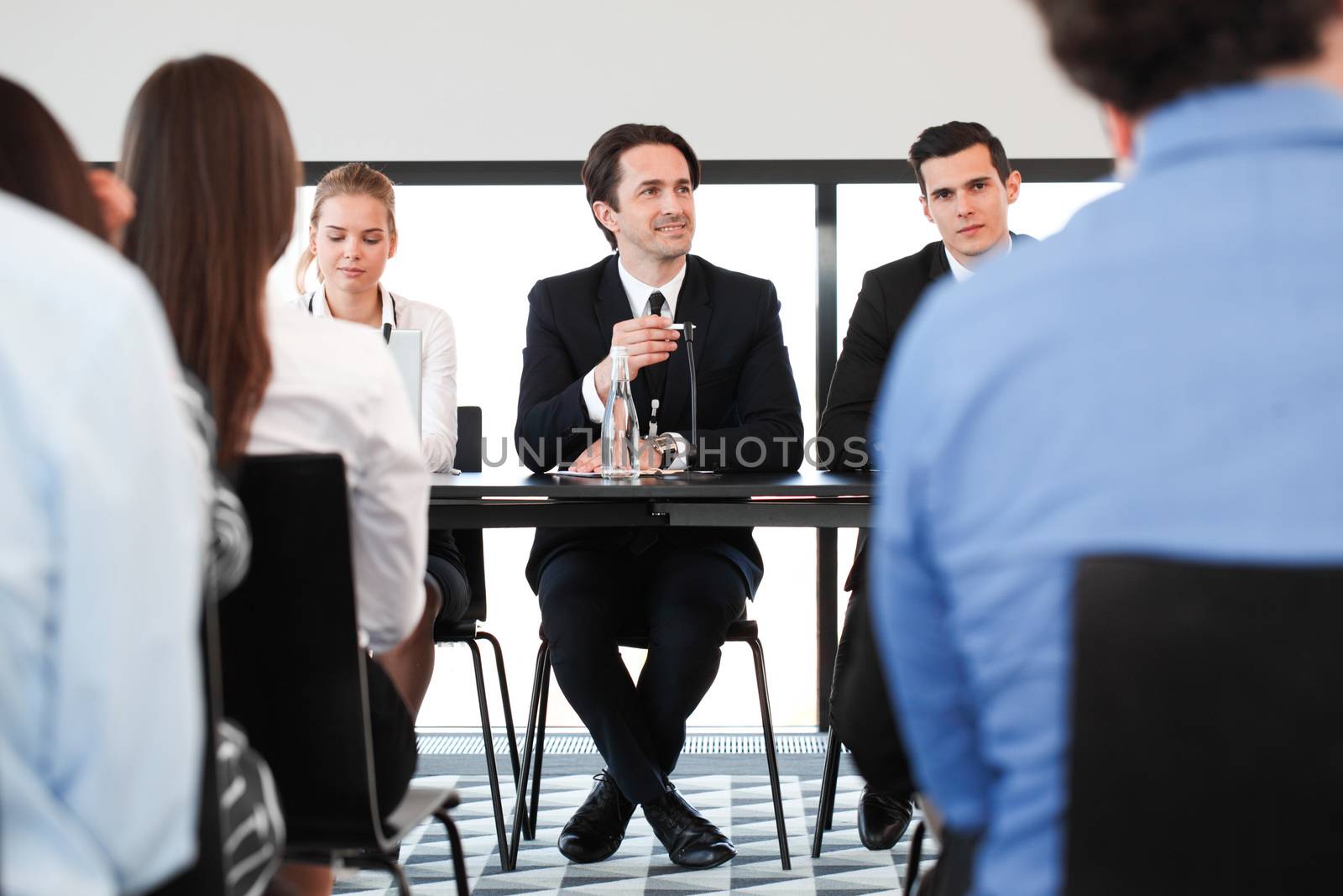 Speakers at business meeting by ALotOfPeople