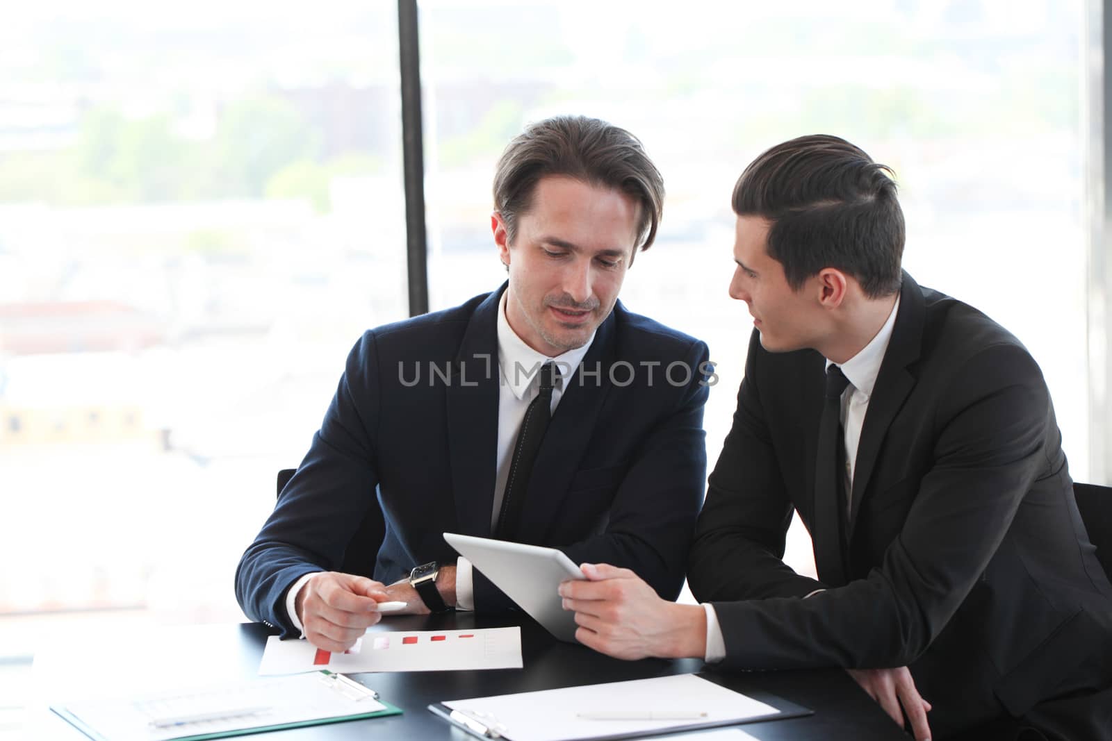 Business people using tablet pc together at office