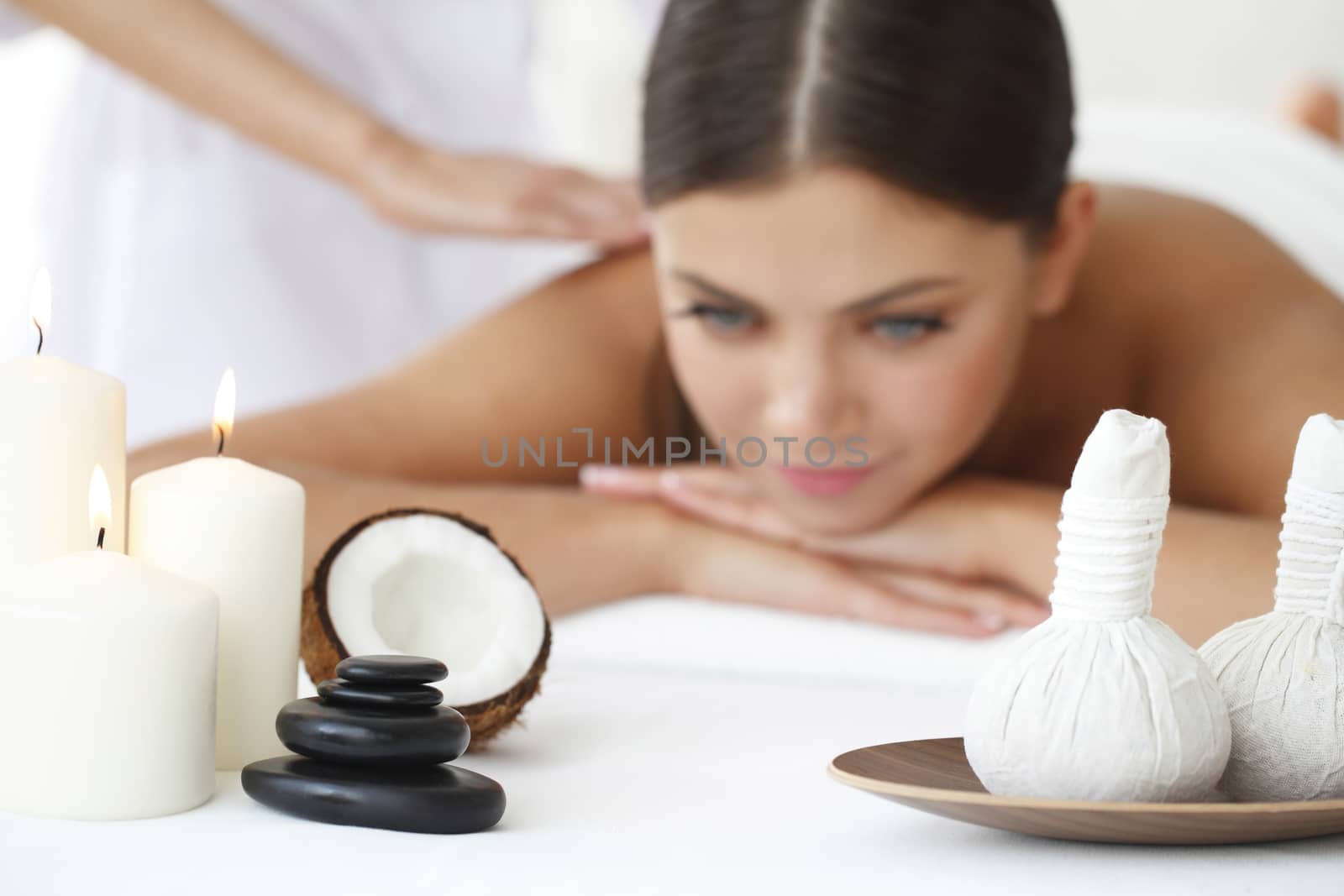Beautiful young woman getting spa massage close up
