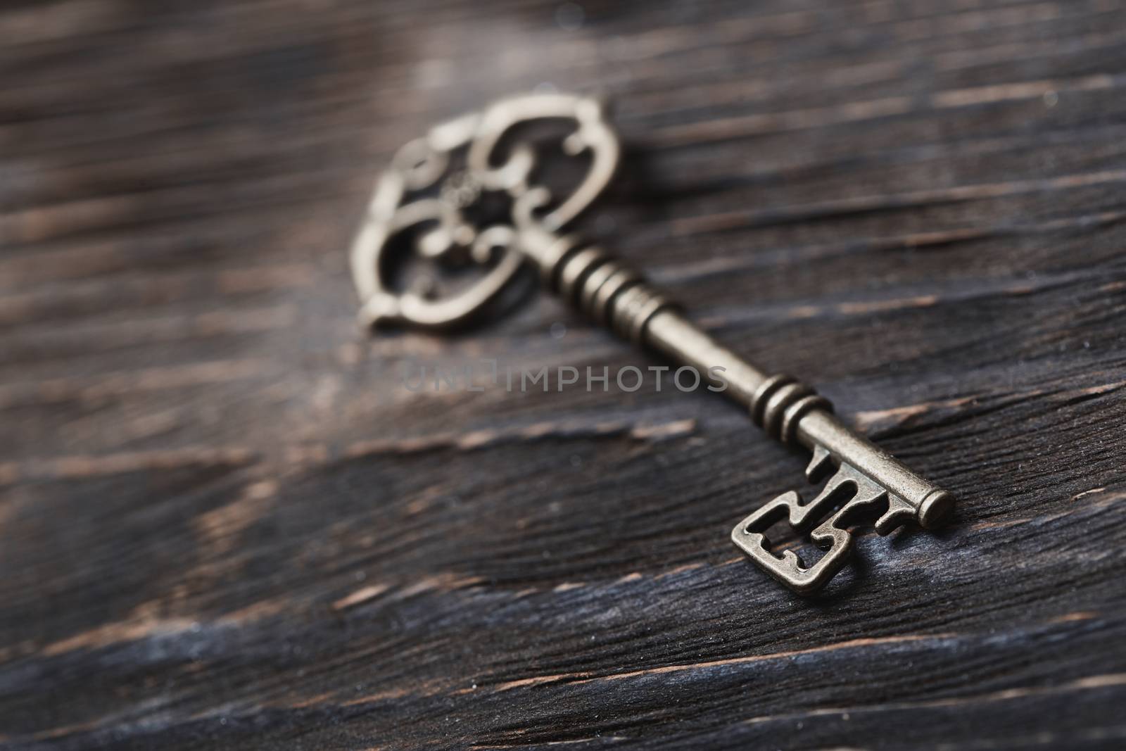 Vintage skeleton key on a table. Close-up