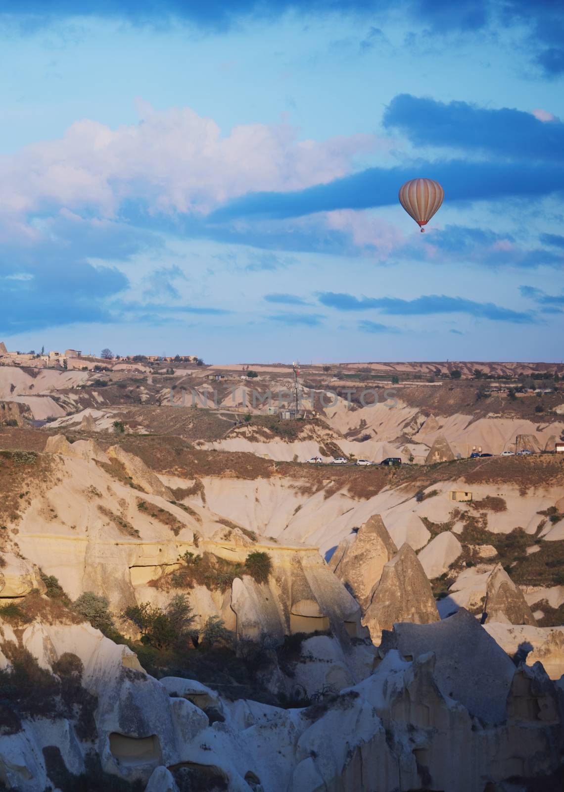 Hot air balloon flying over the rocks of Cappadocia, Turkey