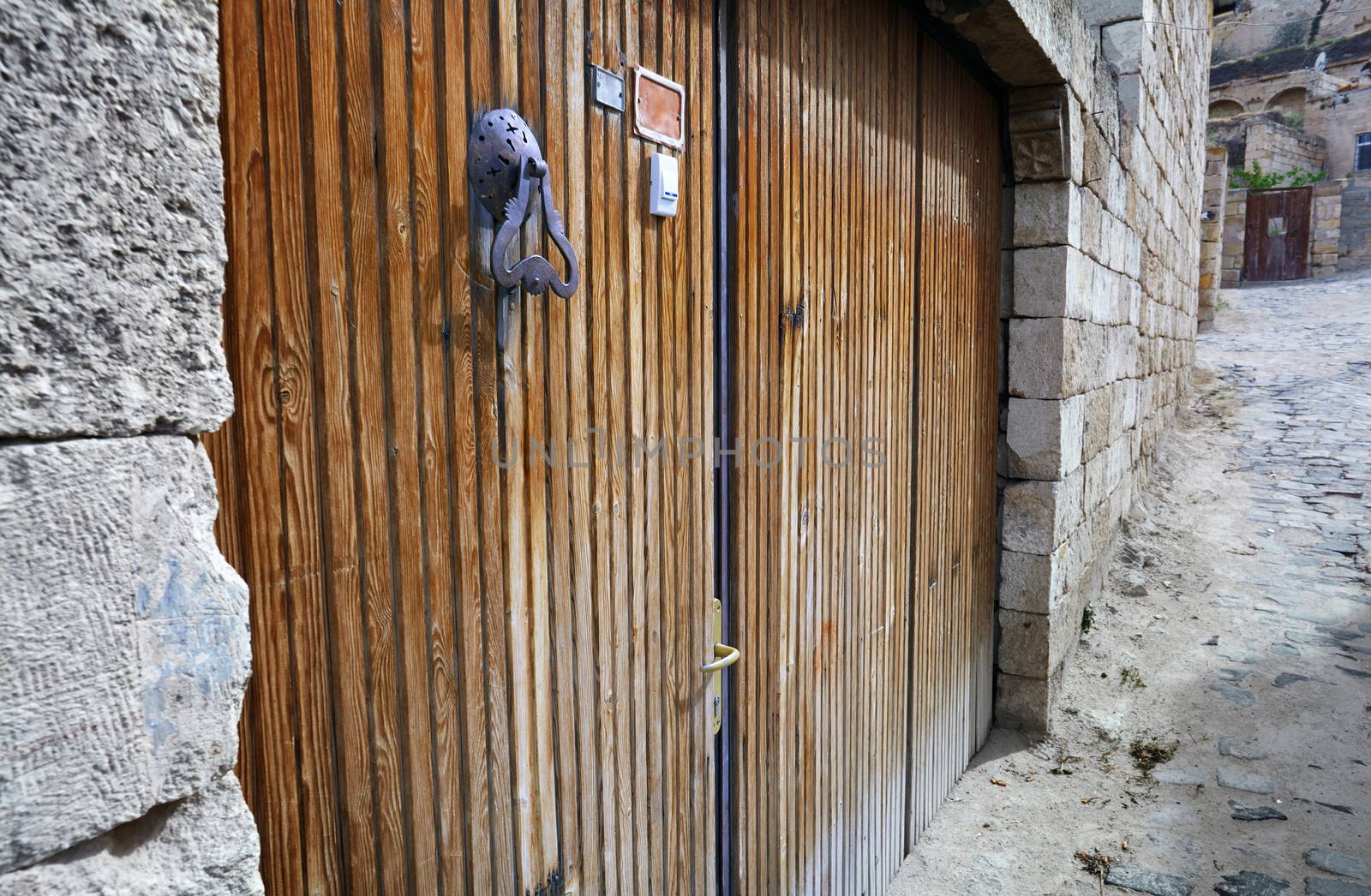 Wooden door of ancient buildings in old town by Novic