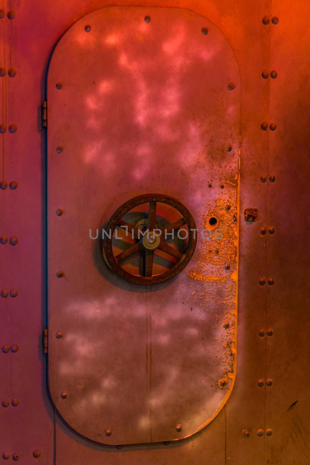 closed rusty submarine door with a valve, old vintage interior, underwater transportation