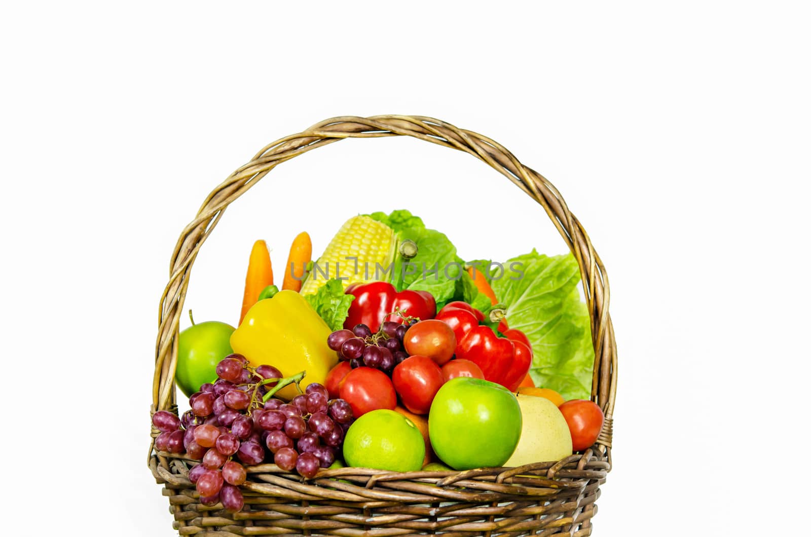 fresh vegetables and fruits in wicker basket over white background