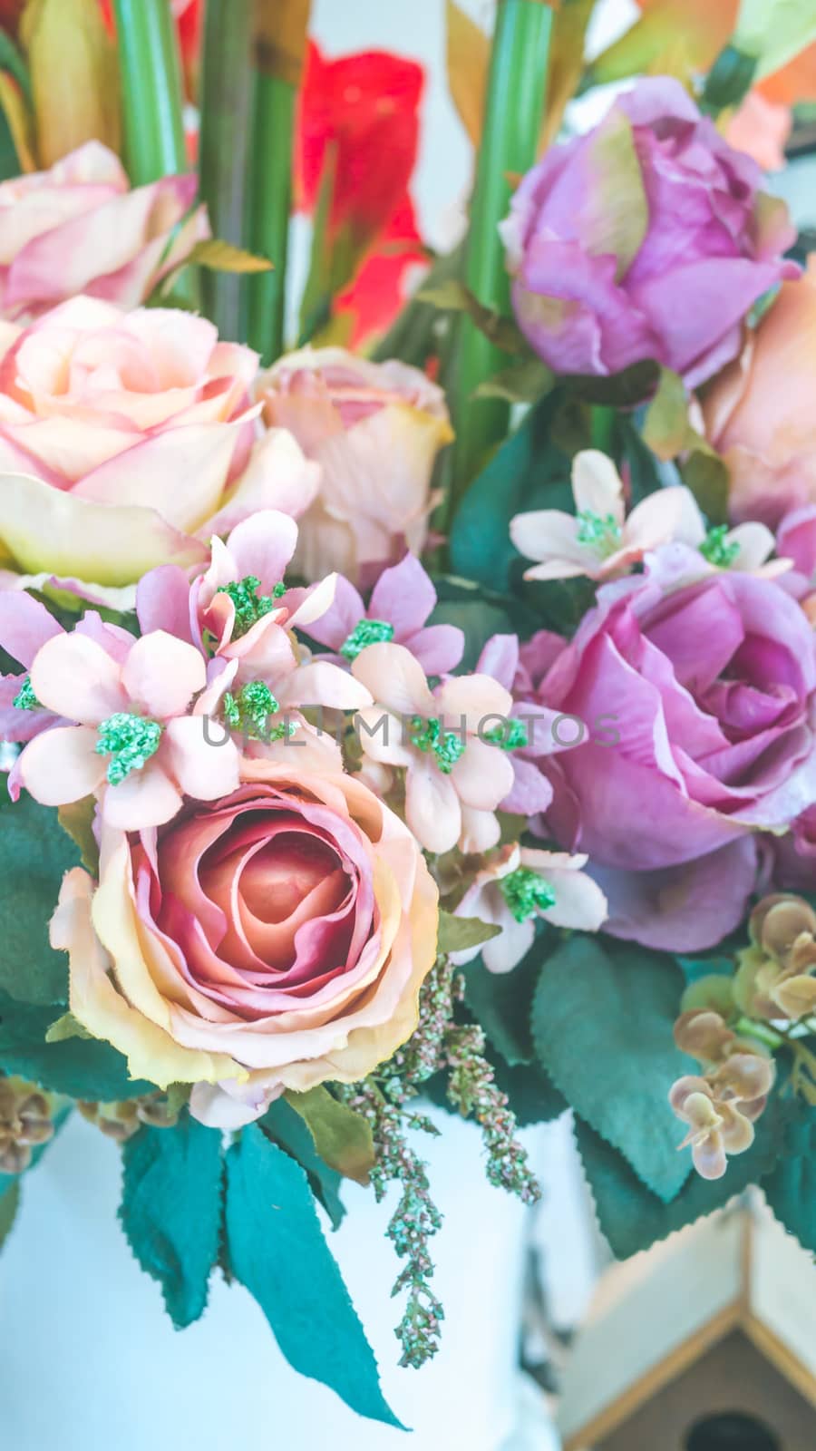 colorful of the plastic flowers bouquet , soft of focus