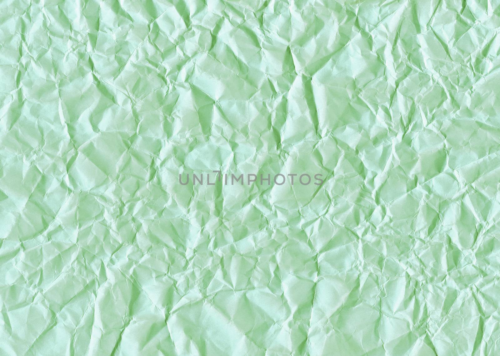 Green texture background of crumpled paper