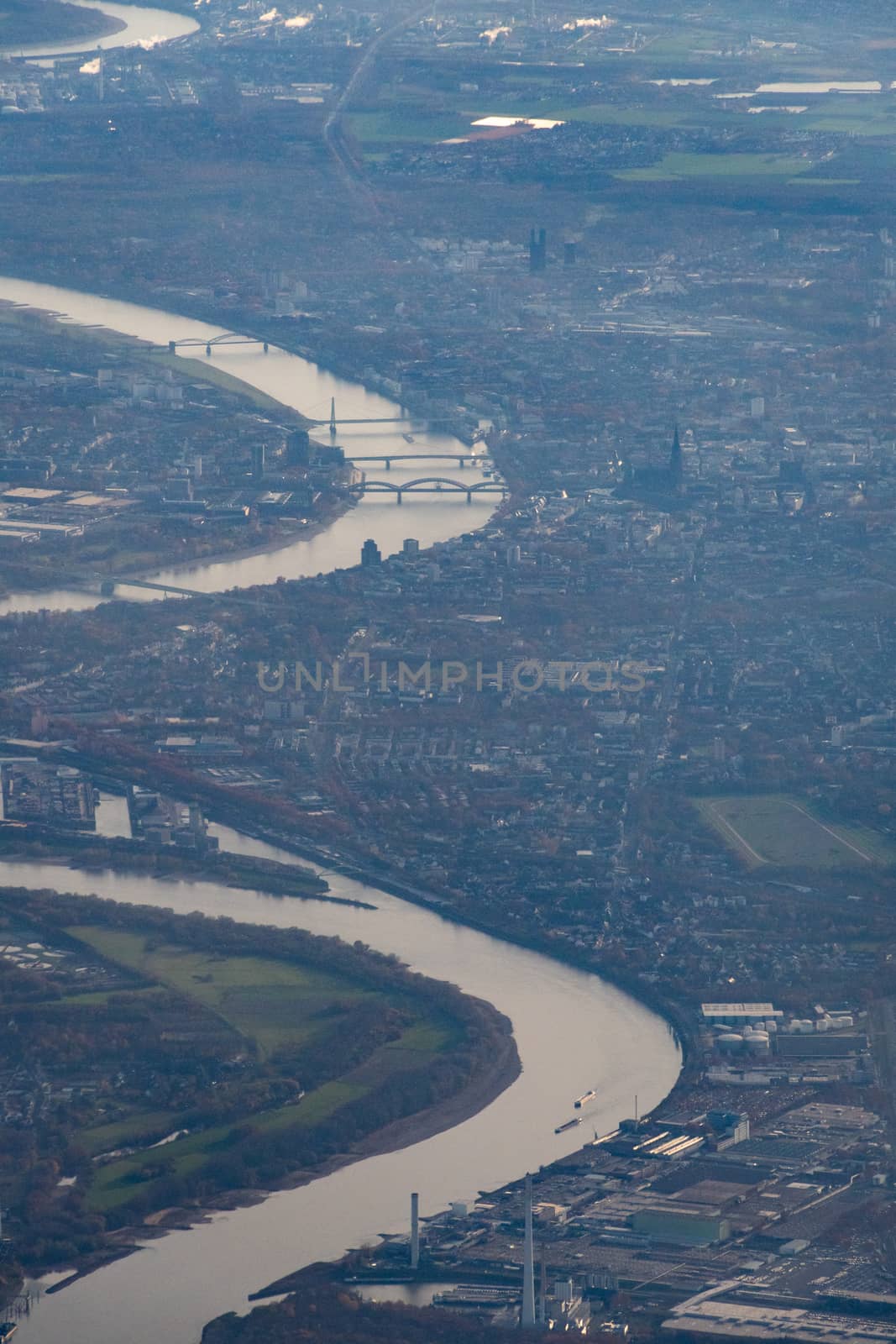 German city of Cologne seen from air with Rhine river, cathedral and more by MXW_Stock