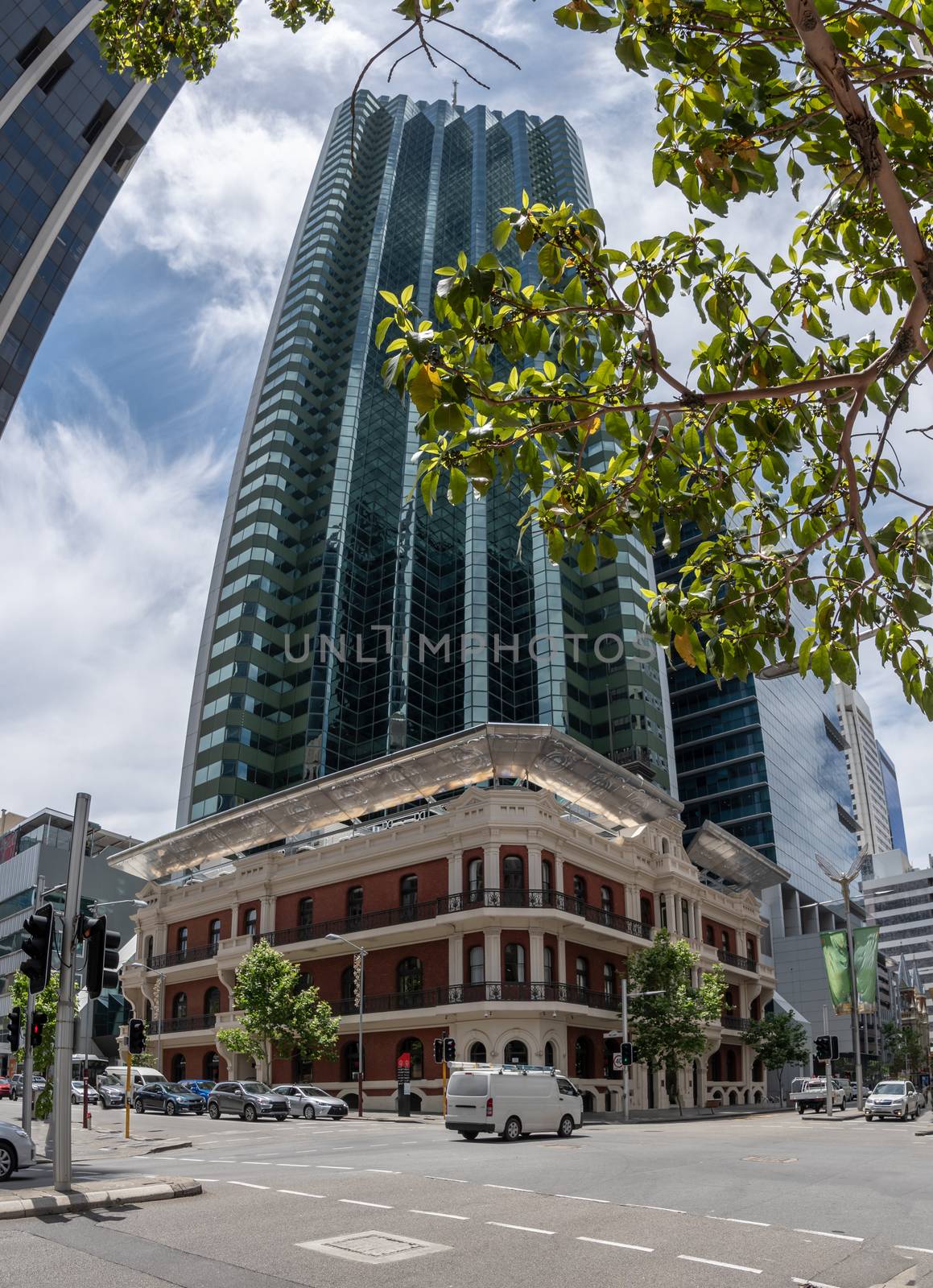 Panorama of old Victorian brick building in front of modern highrise skyscraper in Perth Downtown
