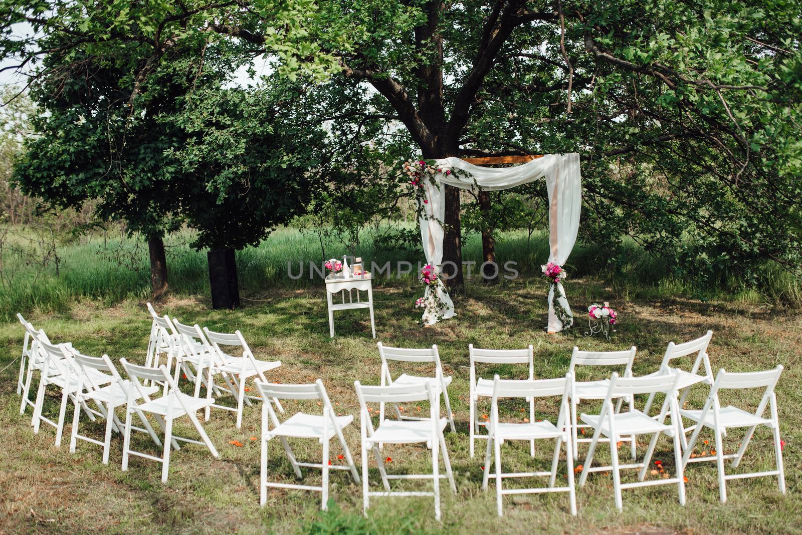 wedding ceremony area, arch chairs decor