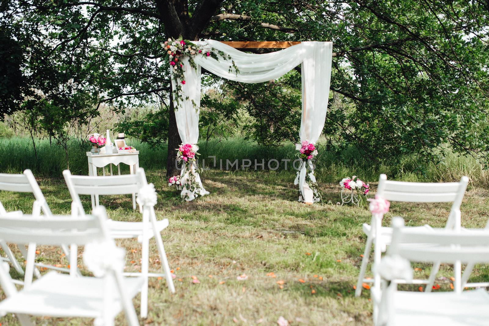 wedding ceremony area, arch chairs decor