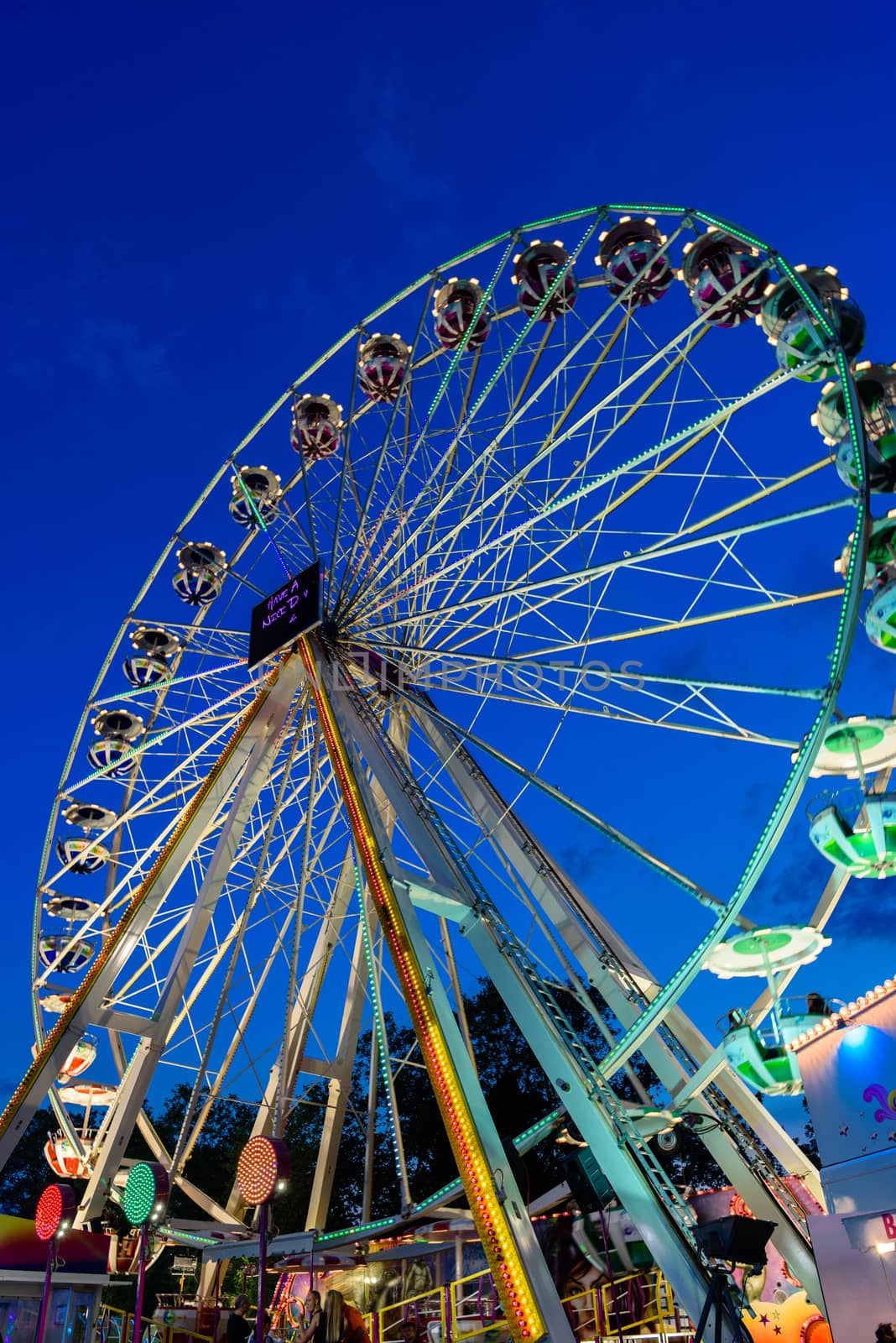 Ferris wheel in amusement park in Lausanne, Switzerland by Eagle2308